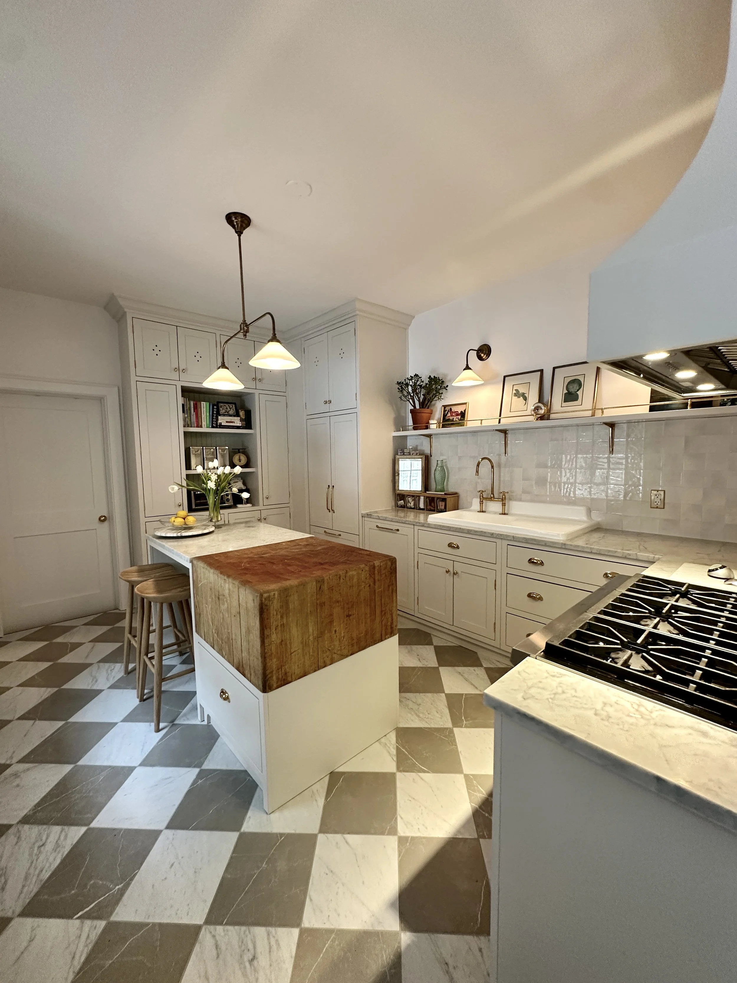 Custom British Kitchen with reclaimed butcher block integrated into the custom island