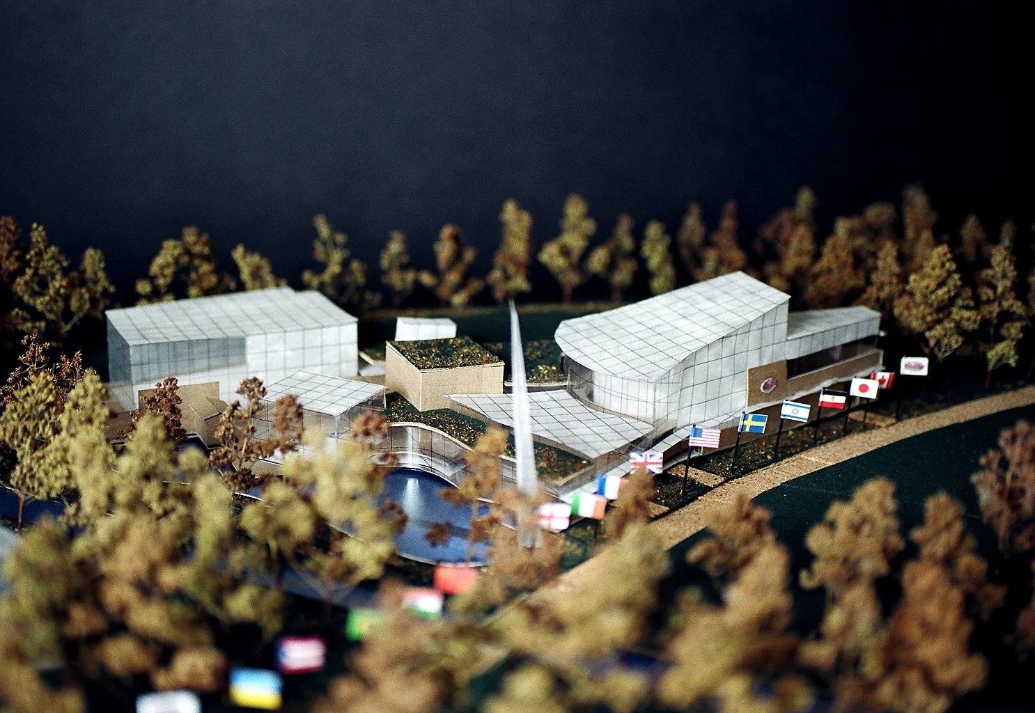 The campus program includes a 400-car parking garage beneath a rooftop playground and garden as well as the restoration of the deteriorated Aberjona riverfront and wetlands, which bisected the site into a flood retention rain garden, a meditation gar