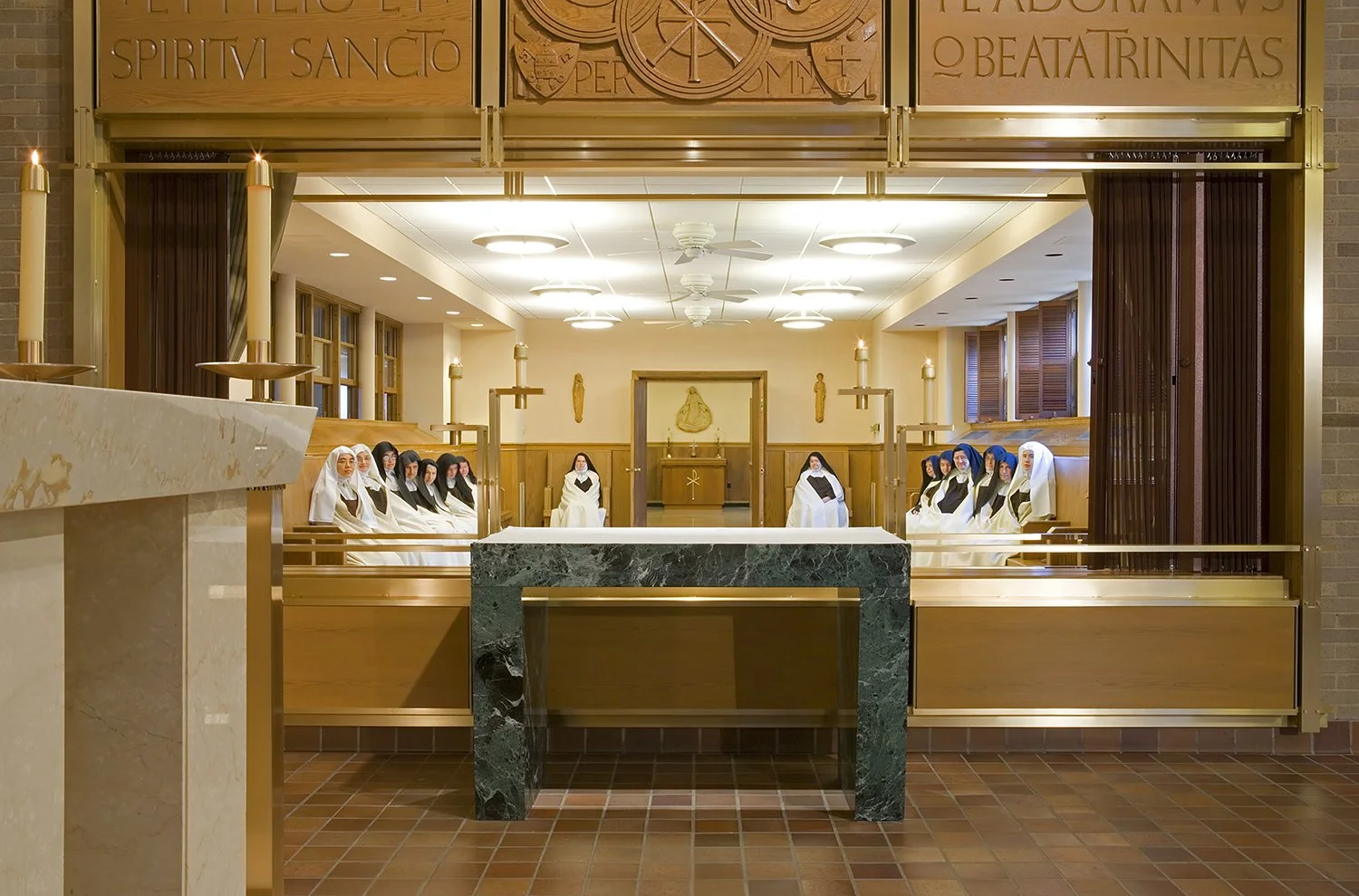 The fully opened screen drapes provide an unobstructed view of the Altar during daily Mass.