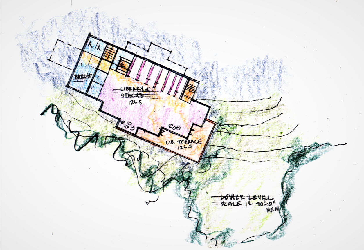 The library, located below the common area village square, with views of the pastoral field and access to an overlooking terrace.