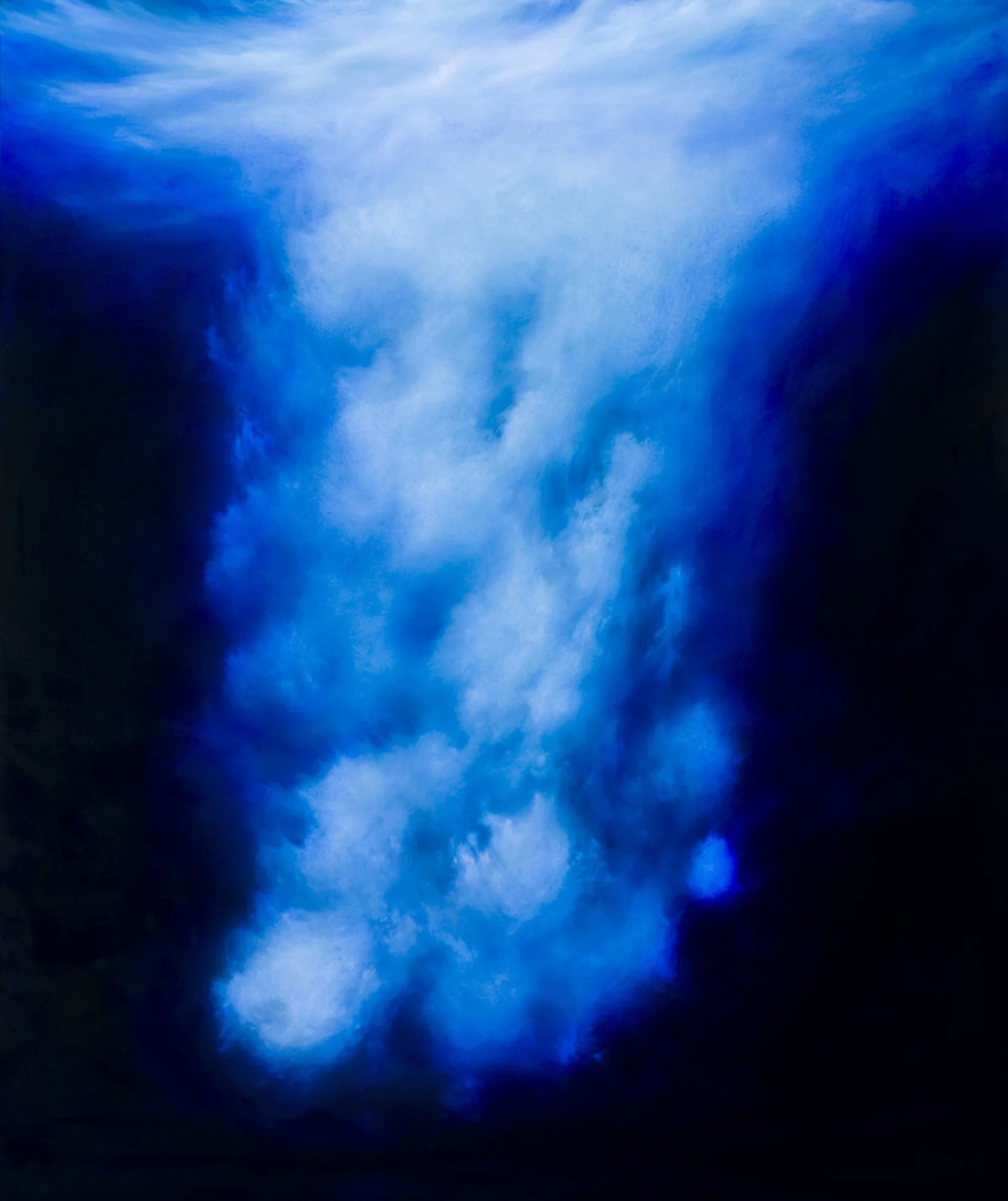 Sky with dark storm clouds and patches of blue sky.