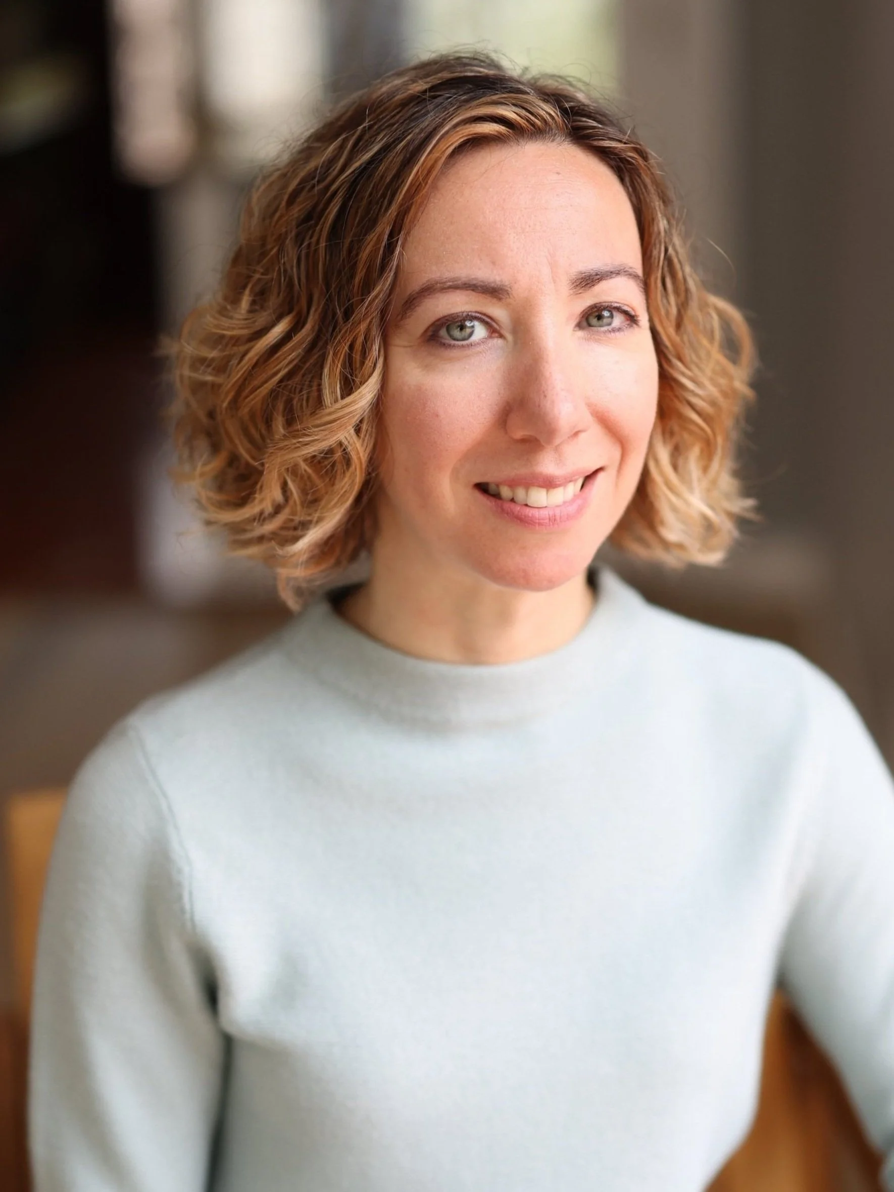 Headshot of woman sitting in chair