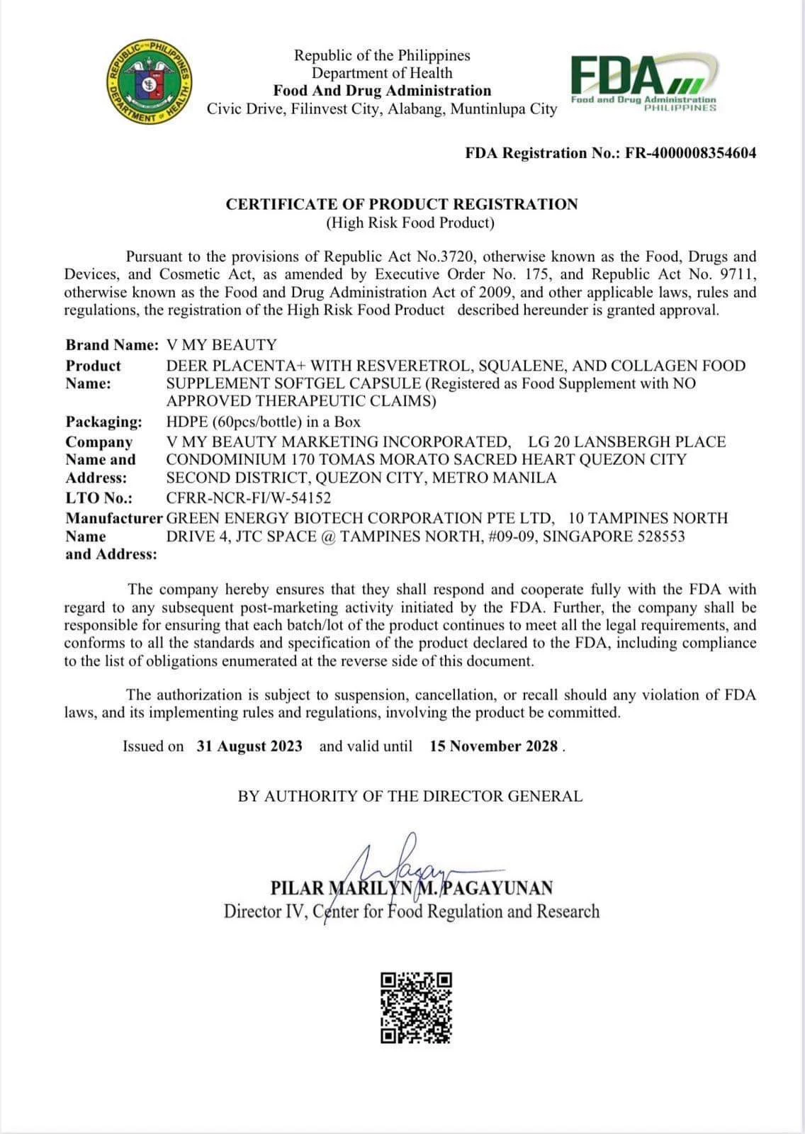 Scenic landscape of a lake surrounded by rolling green hills and mountain ranges in the background, under a cloudy sky.