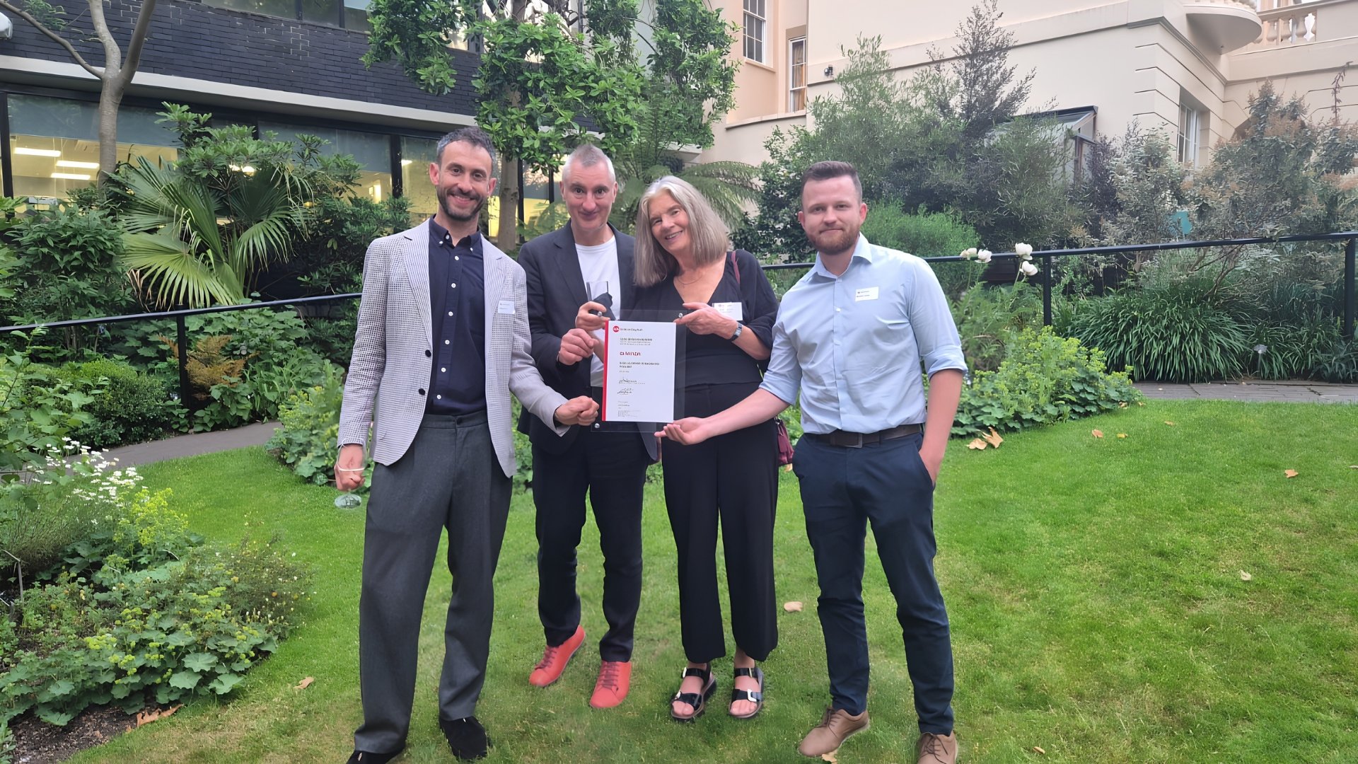 Four people accepting AIA Award