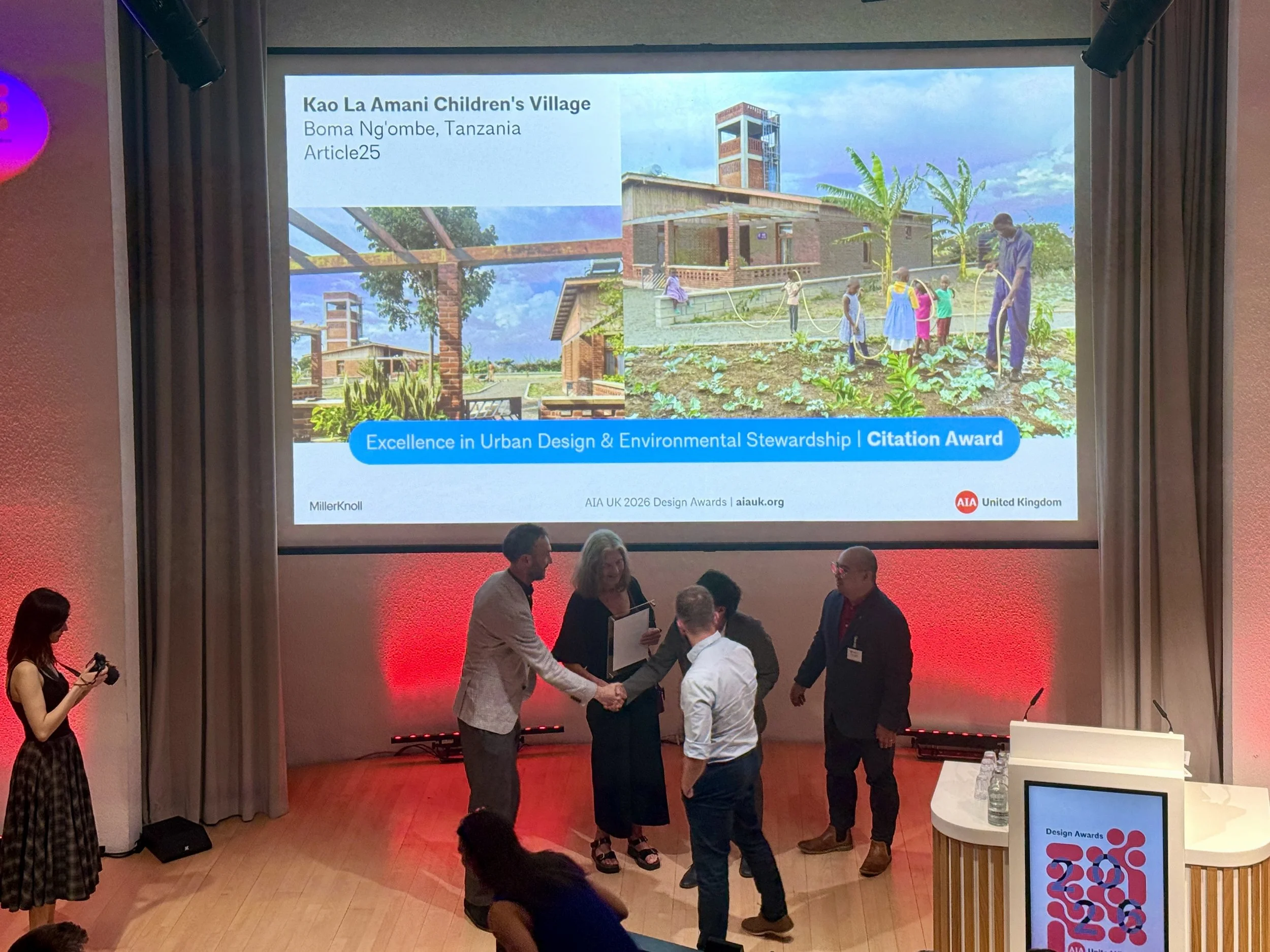 Team accepting the award at the AIA UK Gala