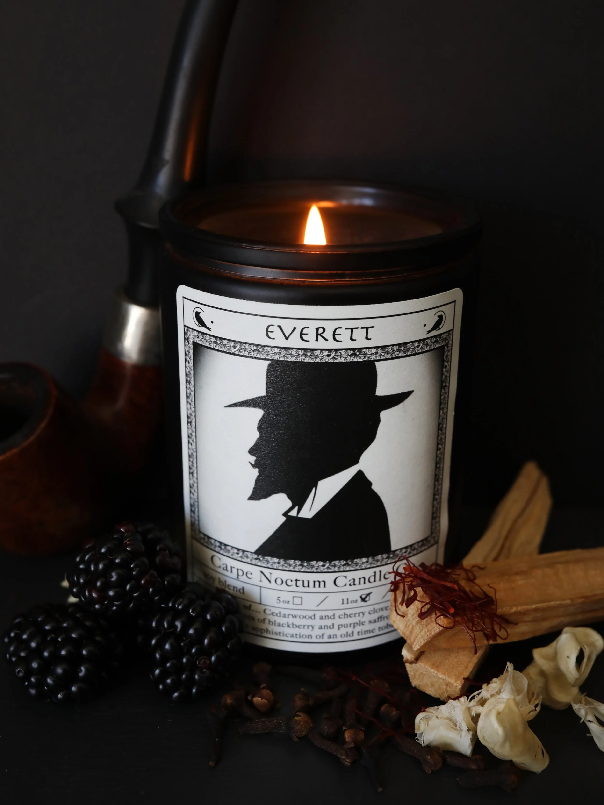 Everett Candle burning with blackberries, palo santo, tobacco