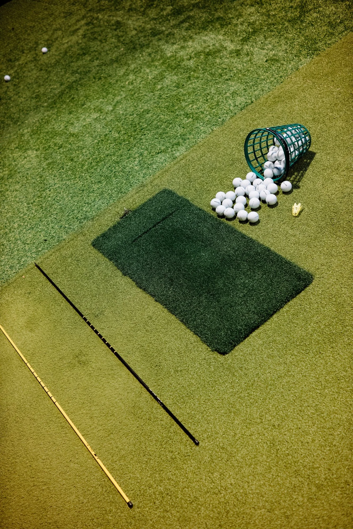 golf practice with alignment sticks pin high
