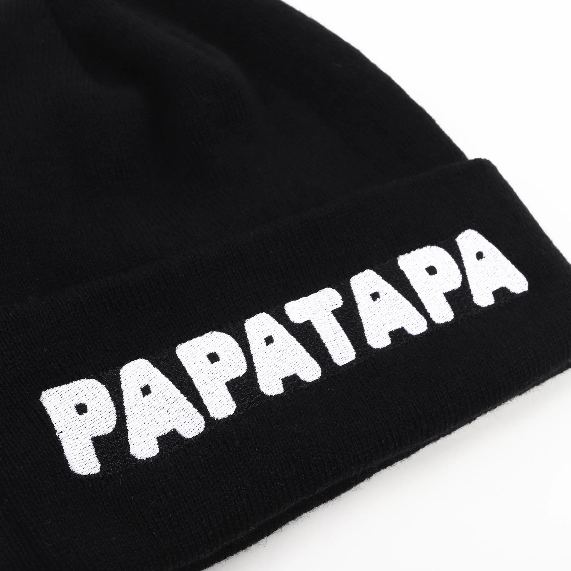 Black beanie hat with white embroidered text that reads 'PAPATAPA'.