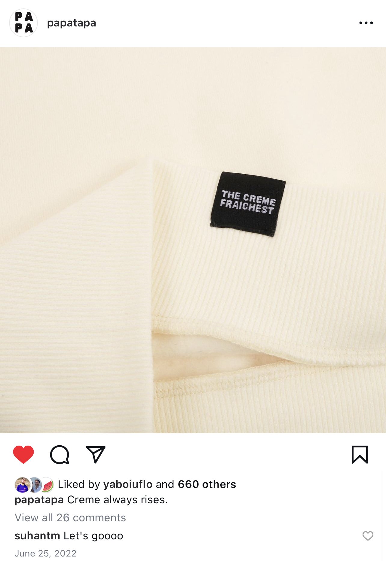 Close-up of a cream-colored ribbed fabric with a black label that reads 'THE CREME FRAICHEST.'