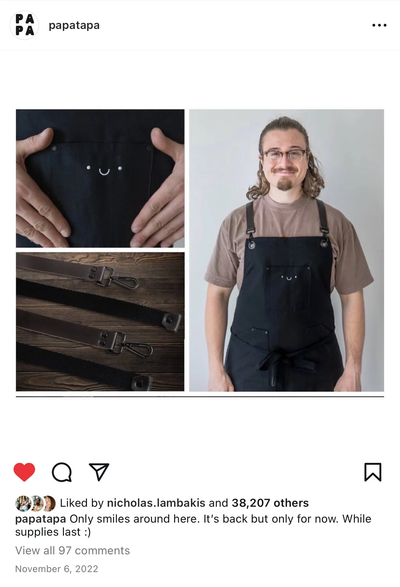 A man wearing a brown t-shirt and black apron with a pocket featuring a cute smiley face is standing in front of a light gray background. The apron has black straps and a waist tie. There are close-up images of the apron and black straps with metal clasps.