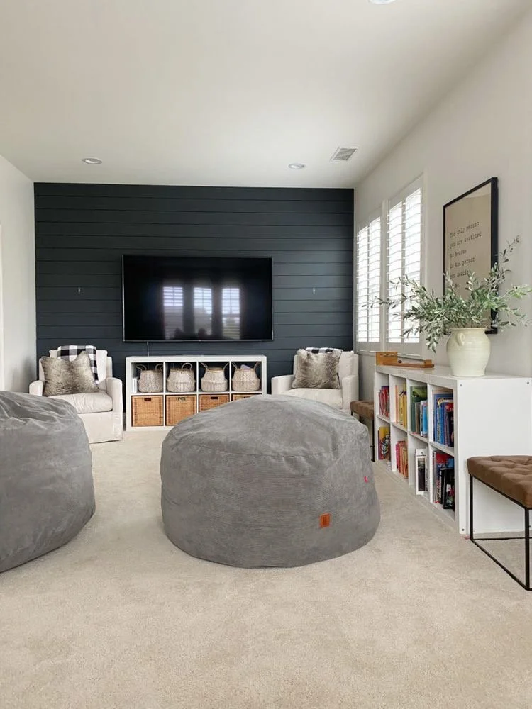Playroom INSPO.  Bean Bag Chairs, Ikea Kallax Units with Baskets, leather ottomans and accent wall!  What a fun flex space for a growing family.  