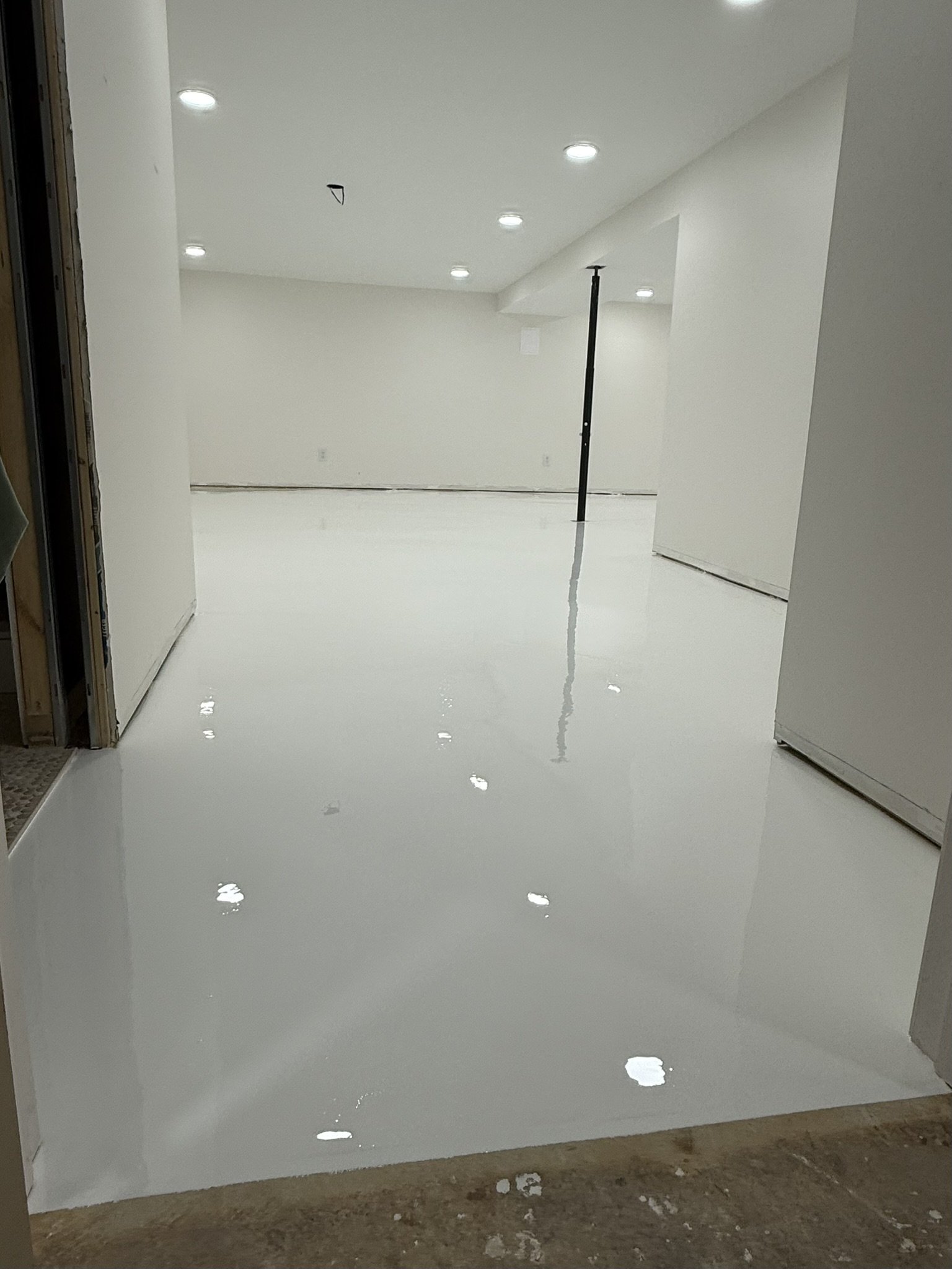 All white epoxy basement floor in Anderson, SC