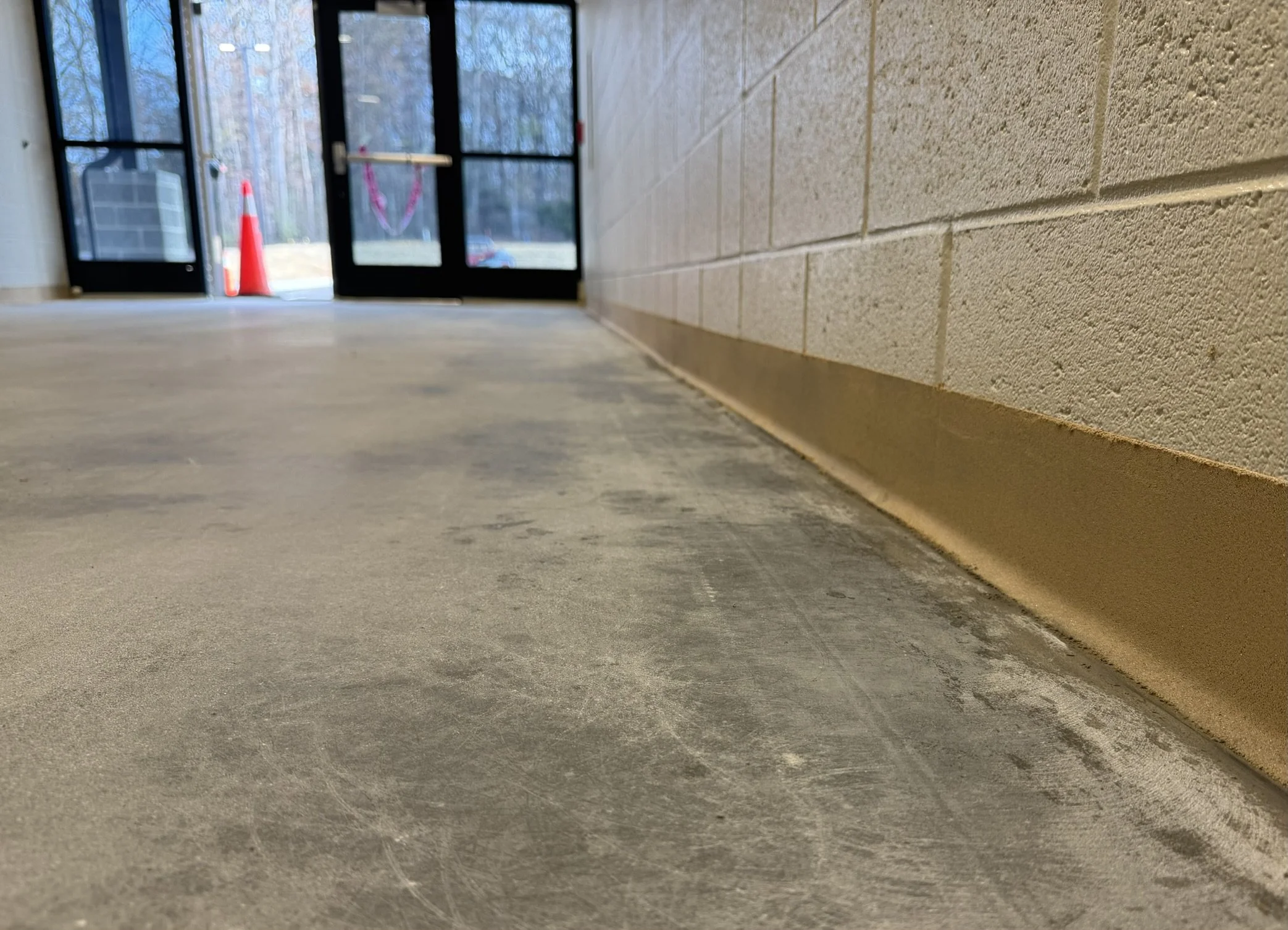 Close-up of epoxy mortar coved base installed in Madison County Ag Center in Danielsville, Georgia