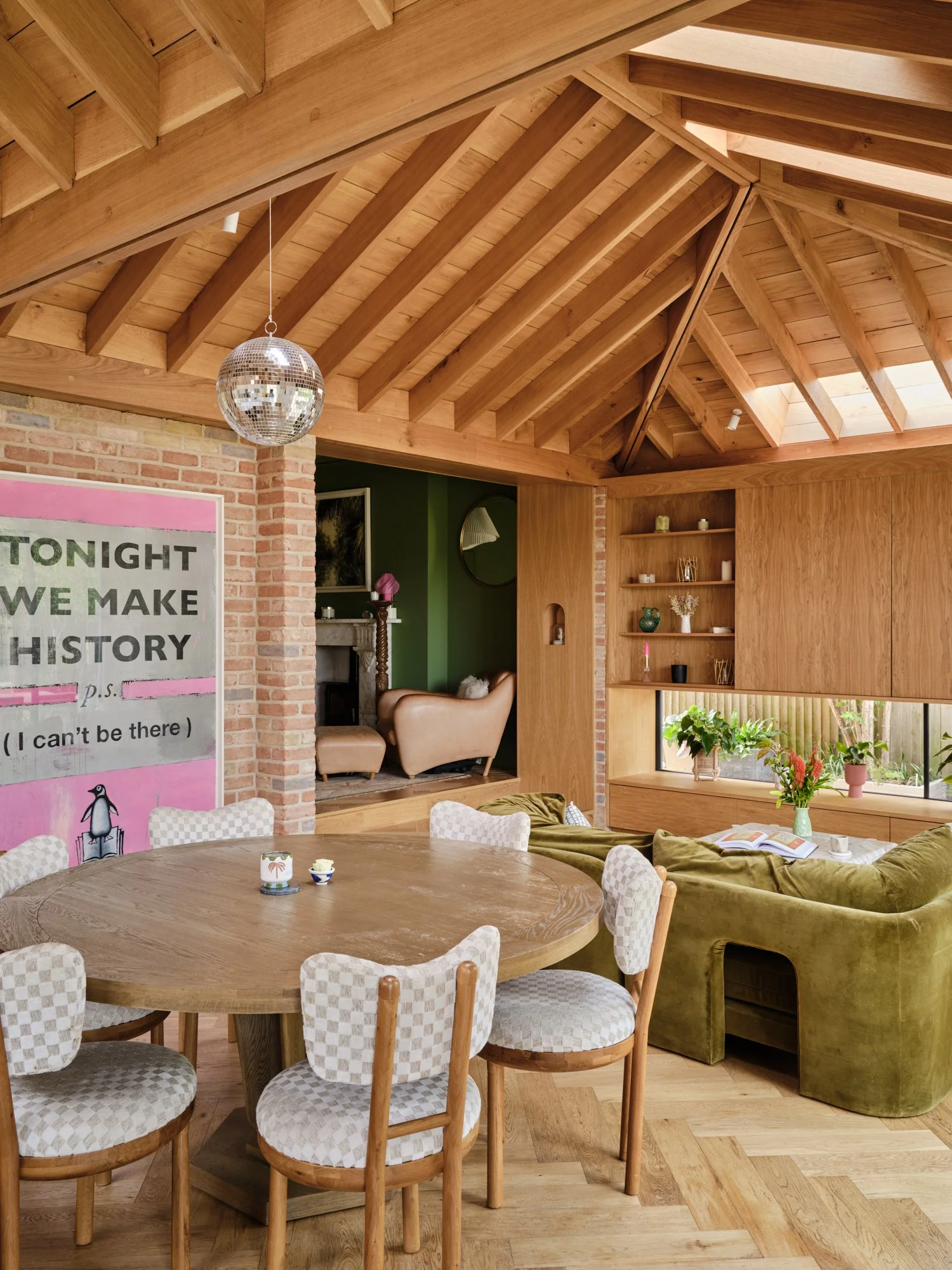 Dining area beneath the vaulted oak roof, with bespoke joinery and exposed brick, Cromwell Road, Teddington