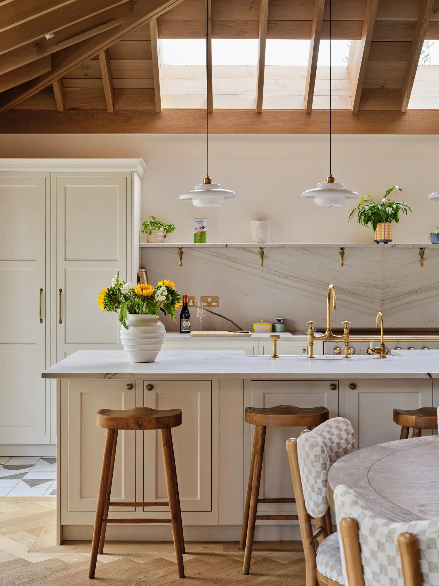 Open-plan kitchen with pale cabinetry beneath oak rafters and rooflights, Cromwell Road, Teddington