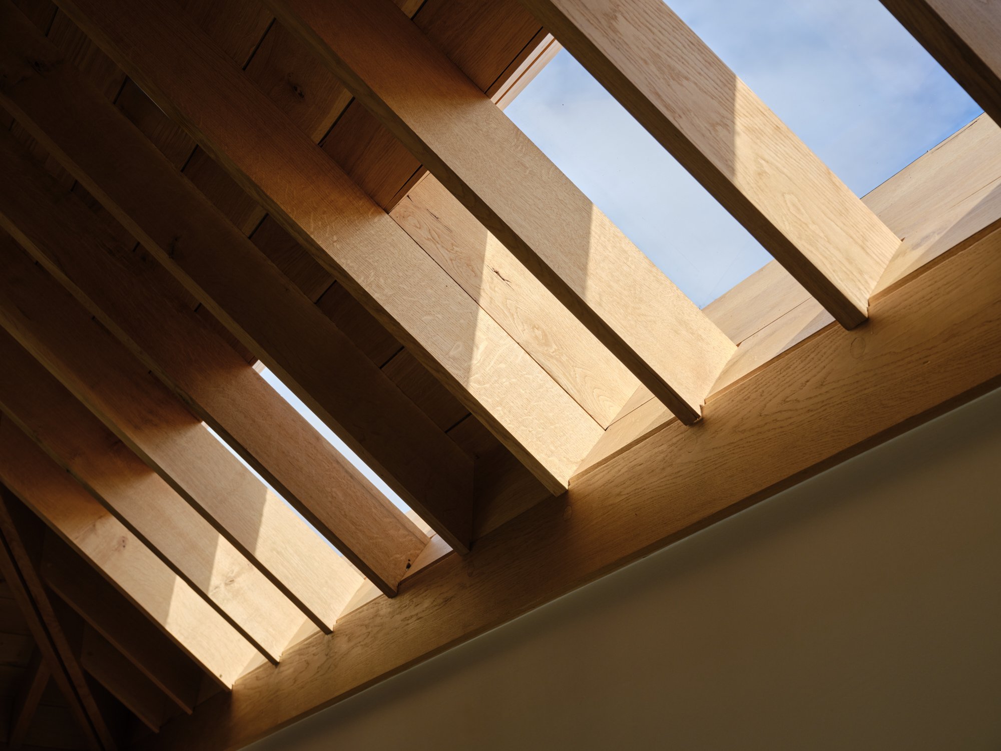 Sunlight through a rooflight between oak rafters, Cromwell Road, Teddington
