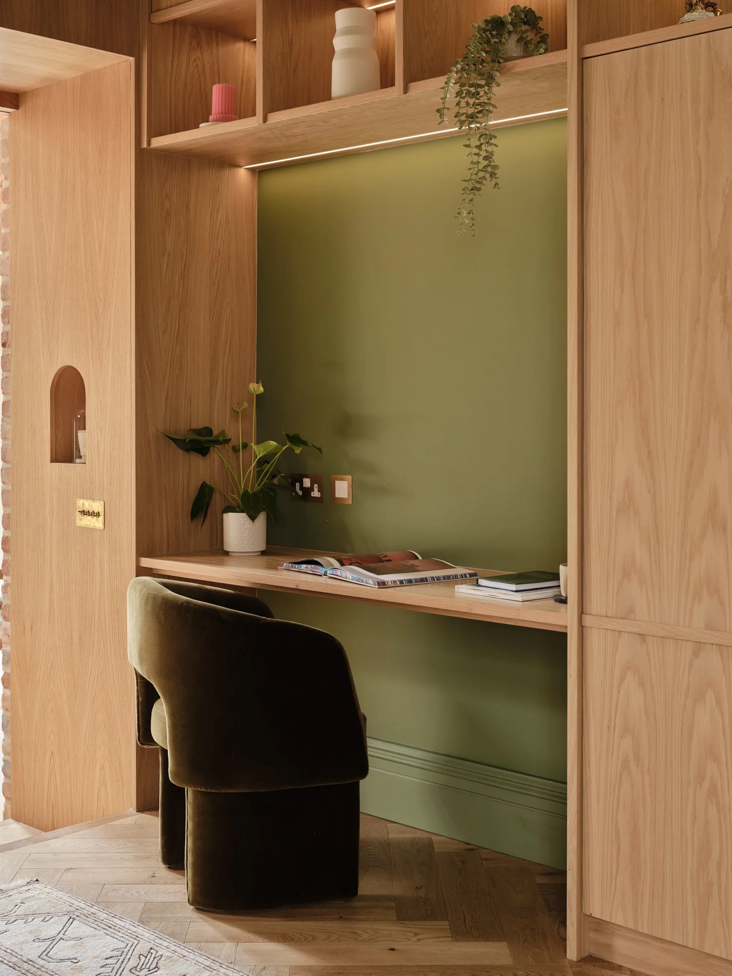 Library desk and chair set into green-painted oak joinery, Cromwell Road, Teddington
