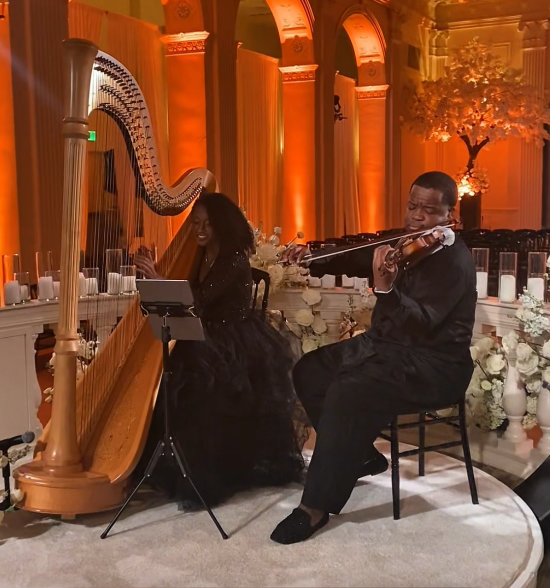Angel Harpist Strings is an Atlanta-based harp, violin and cello trio led by harpist Angelica Hairston, a Black harpist and African American Violinist play at the Biltmore Atlanta for a wedding ceremony.