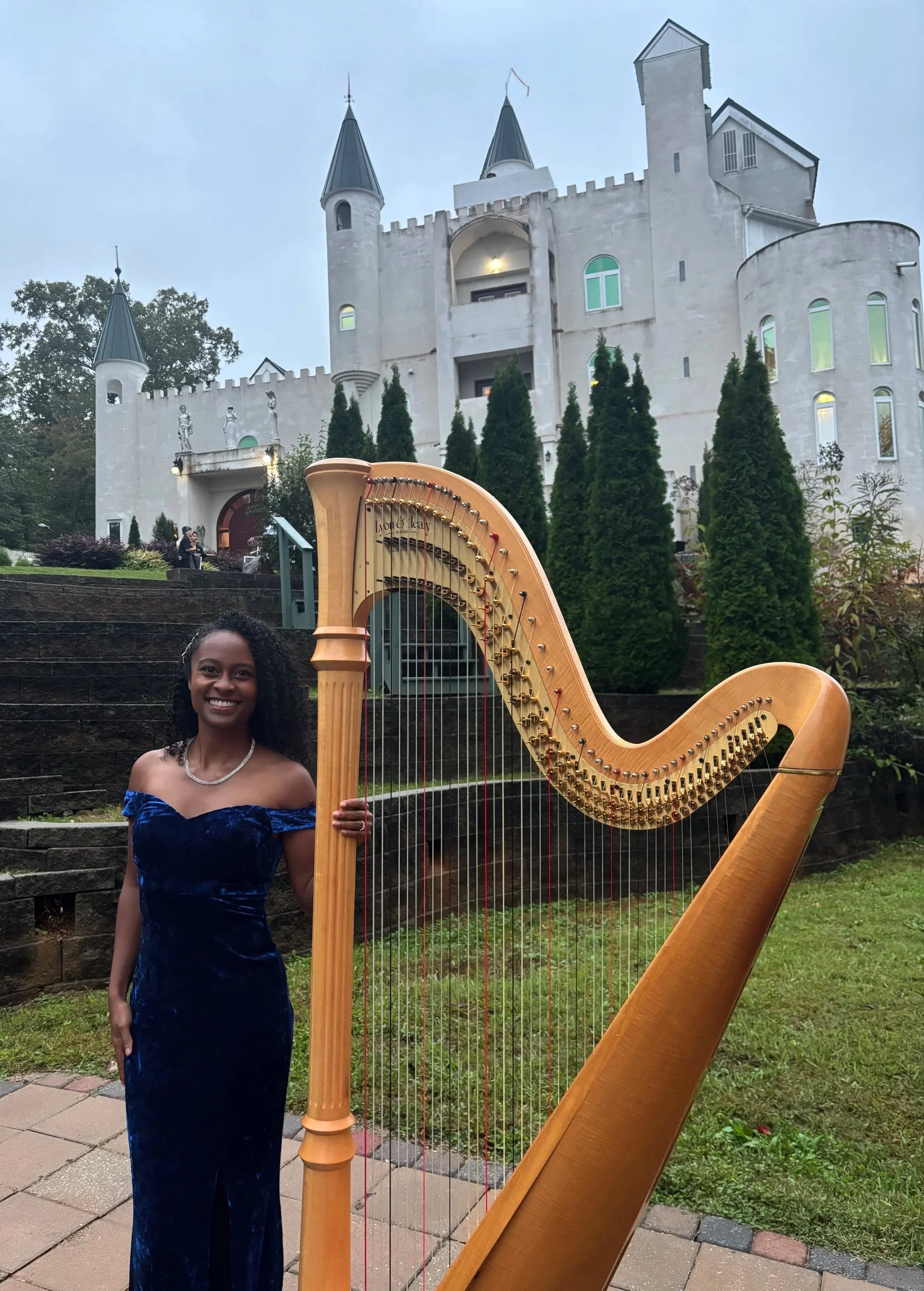 Harpist Angelica Hairston performs at Uhuburg Castle in Helen Georgia for a luxury wedding ceremony. Angelica Hairston is a harpist who performs in Georgia