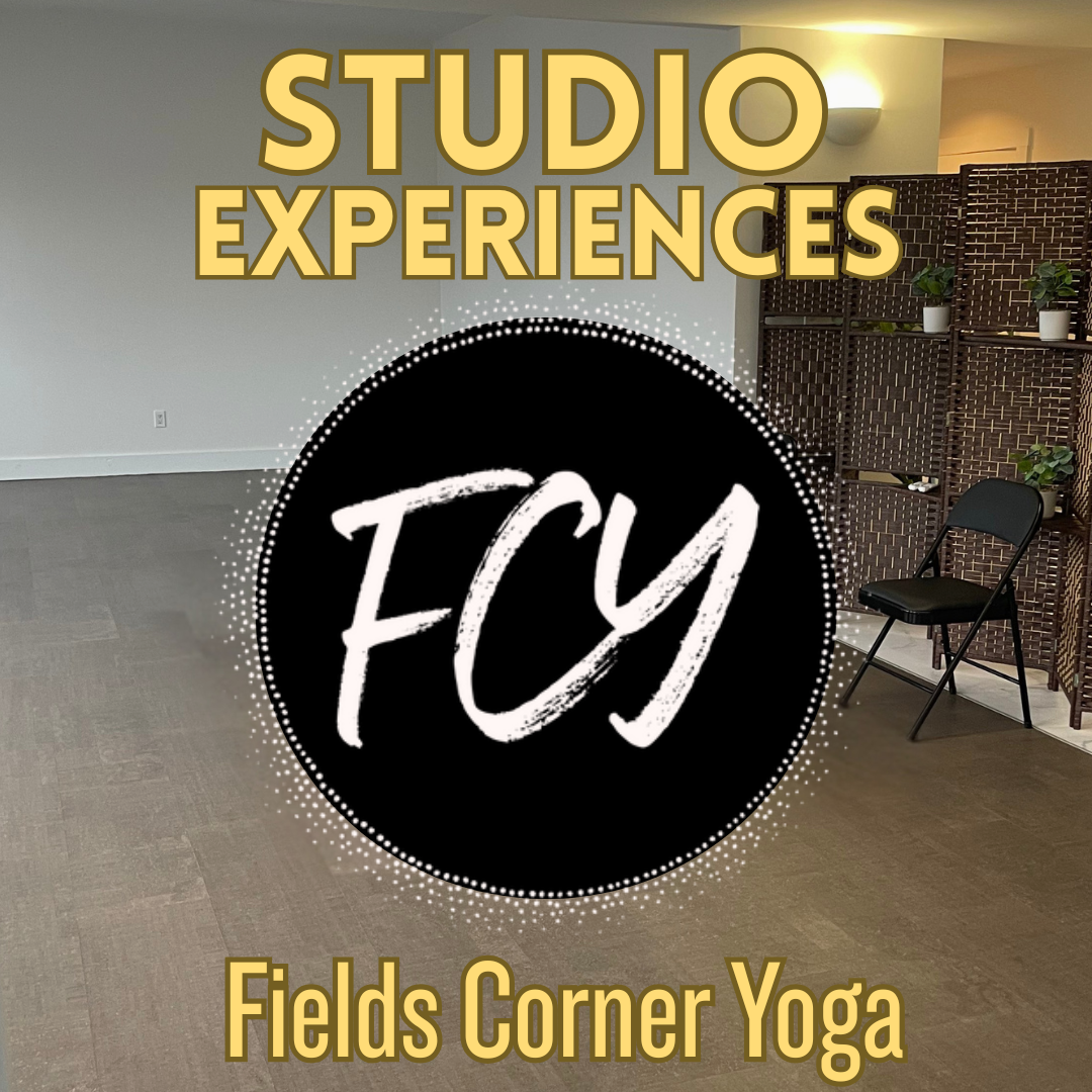 A promotional sign for Fields Corner Yoga featuring the text 'Studio Experiences FYI' and 'Fields Corner Yoga' in a room with a gray wall, wooden floor, a black chair, and a woven room divider with potted plants.