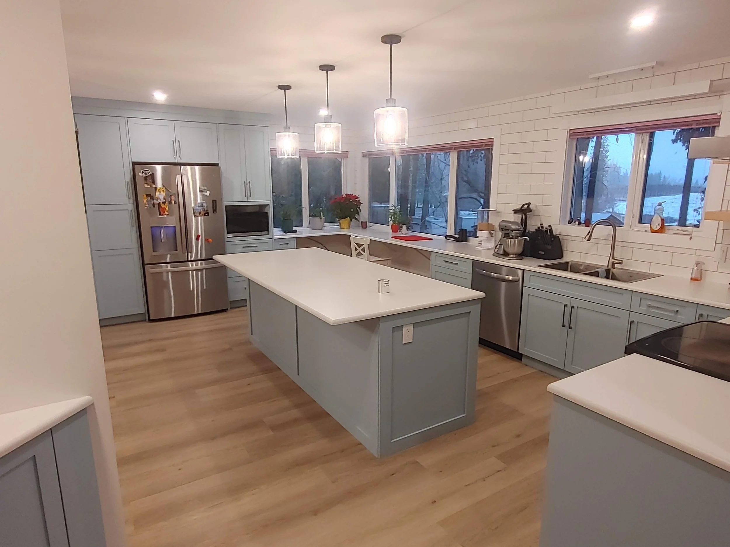 Complete kitchen including cabinets, laminate countertops, and tile backsplash. Customer selected their own custom paint color.