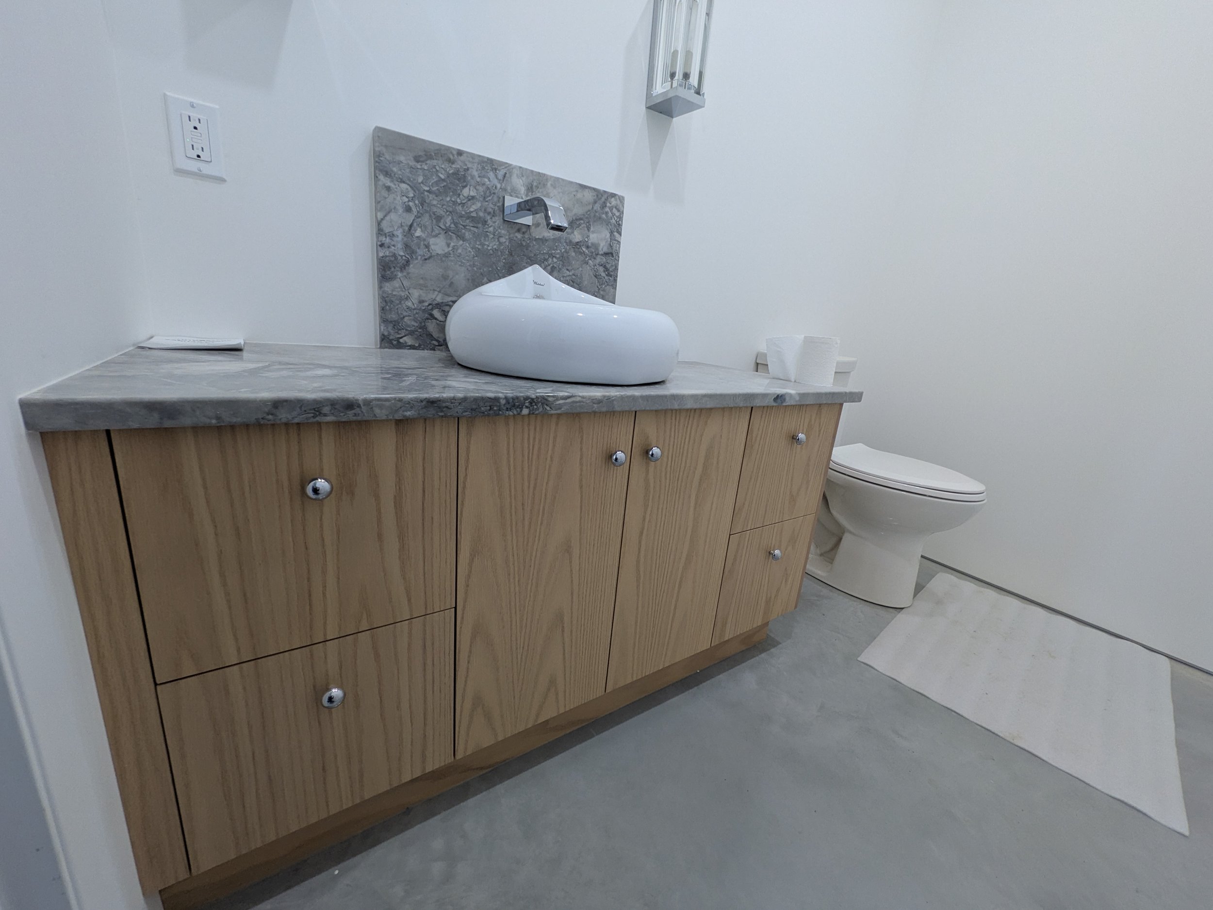 Powder Room vanity - lower for vessel sink and wall faucet