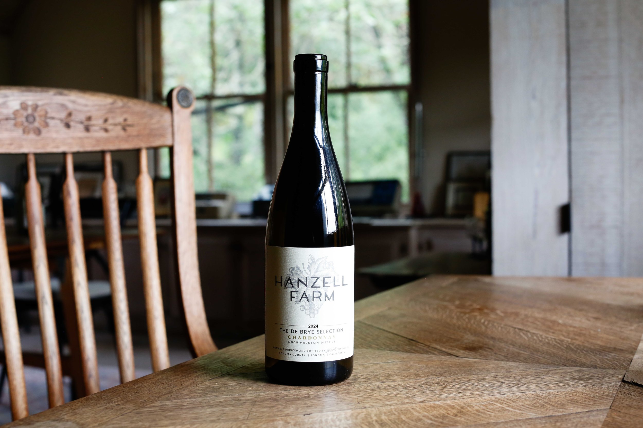 Bottle of Hanzell Farm Chardonnay, The de Brye Selection sitting on a desk