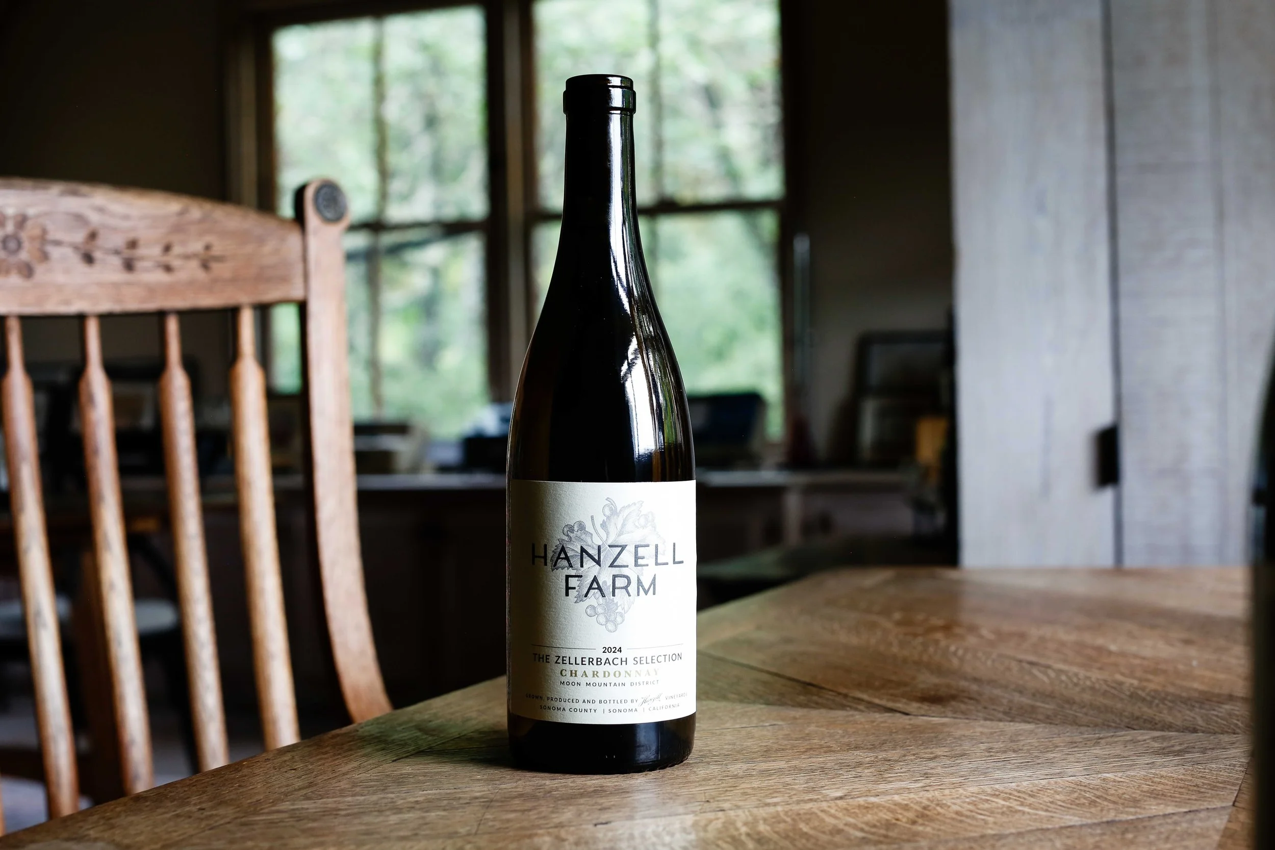 Bottle of Hanzell Farm, The Zellerbach Selection Chardonnay sitting on a desk