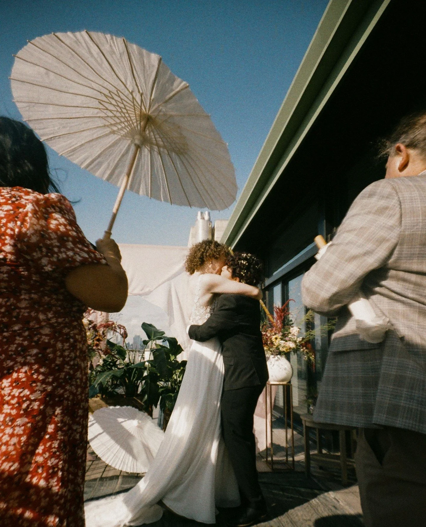 Dreamy lomo 35mm film of R&iacute;o &amp; Hope's sunny rooftop garden microwedding at @brooklyngrange this past July 🎞️ 🌿 They were one of three winners of @pridegrows, a queer vendor-driven project which sponsors LGBTQIA+ weddings in Brooklyn.⁠ 🌈