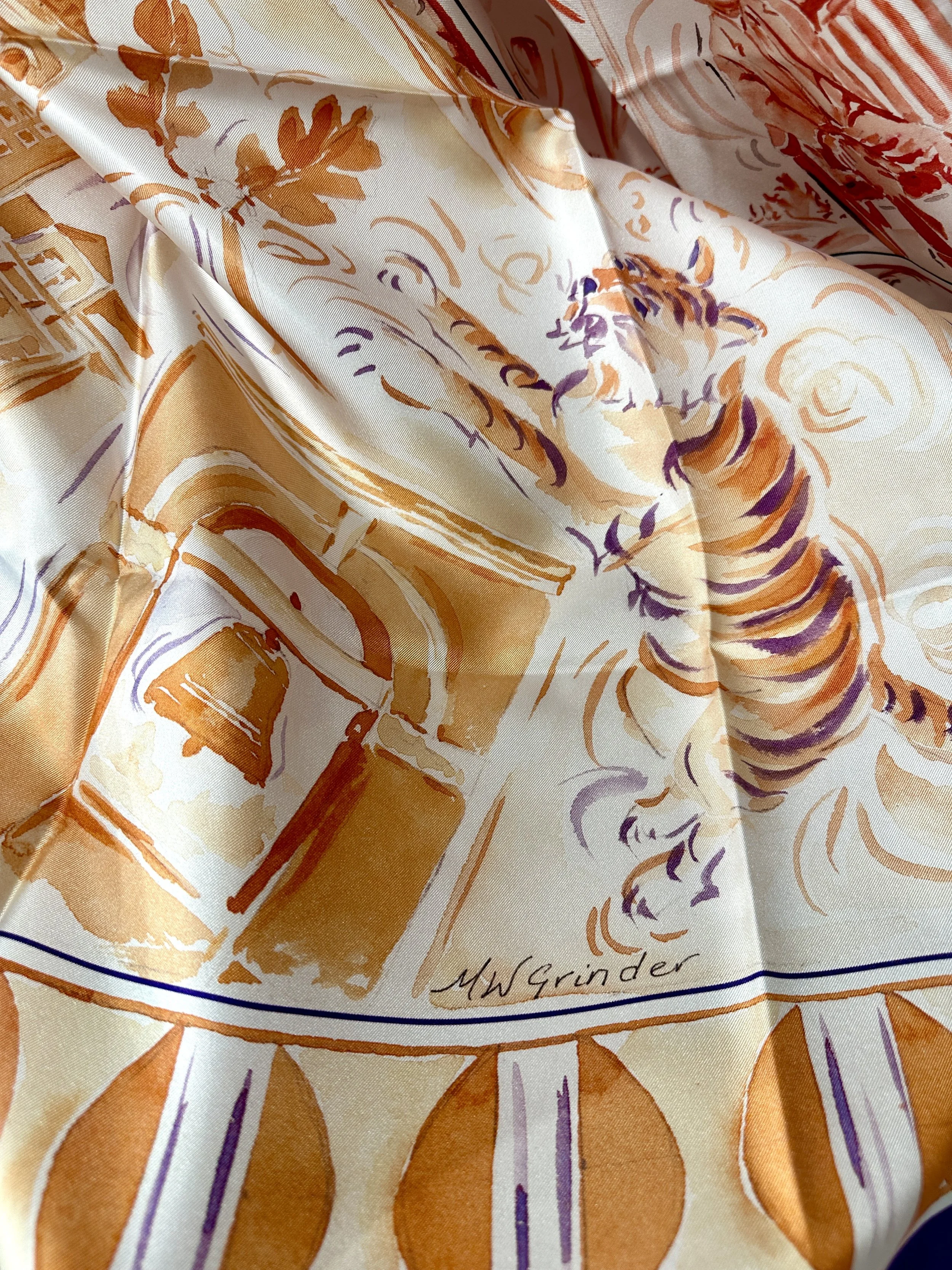 Clemson watercolor silk scarf by Megan Grinder, shown on the diamond, with tigers and Tillman Hall in orange and purple inside a purple border