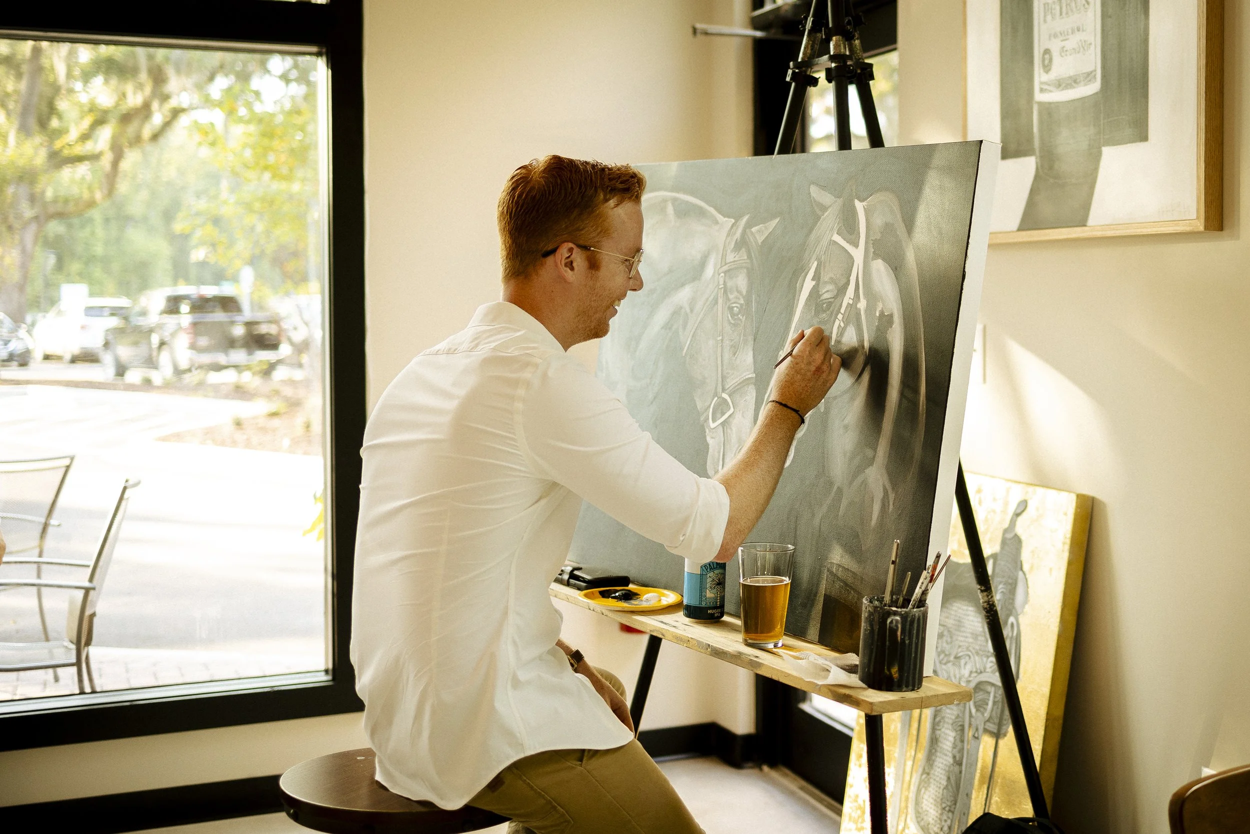 Thursdays are Sip & Live Painting with Jeremy Aiken - Local Artist. His artwork are all over the wine bar