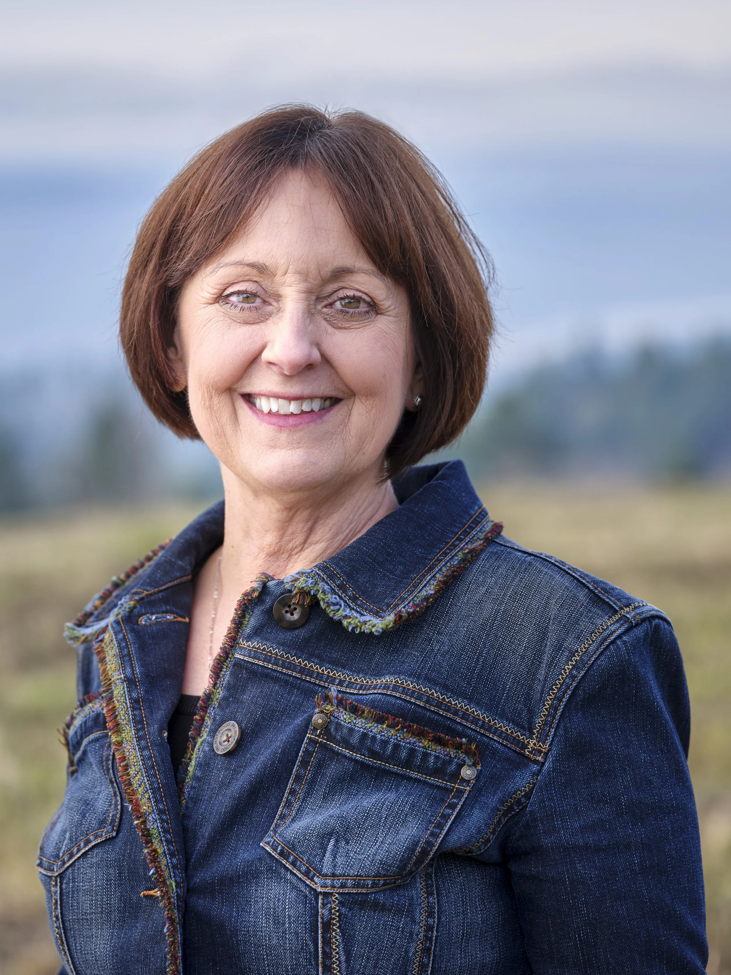 Owner of Woodland Real Estate and broker portrait photographed on location near the Columbia River.