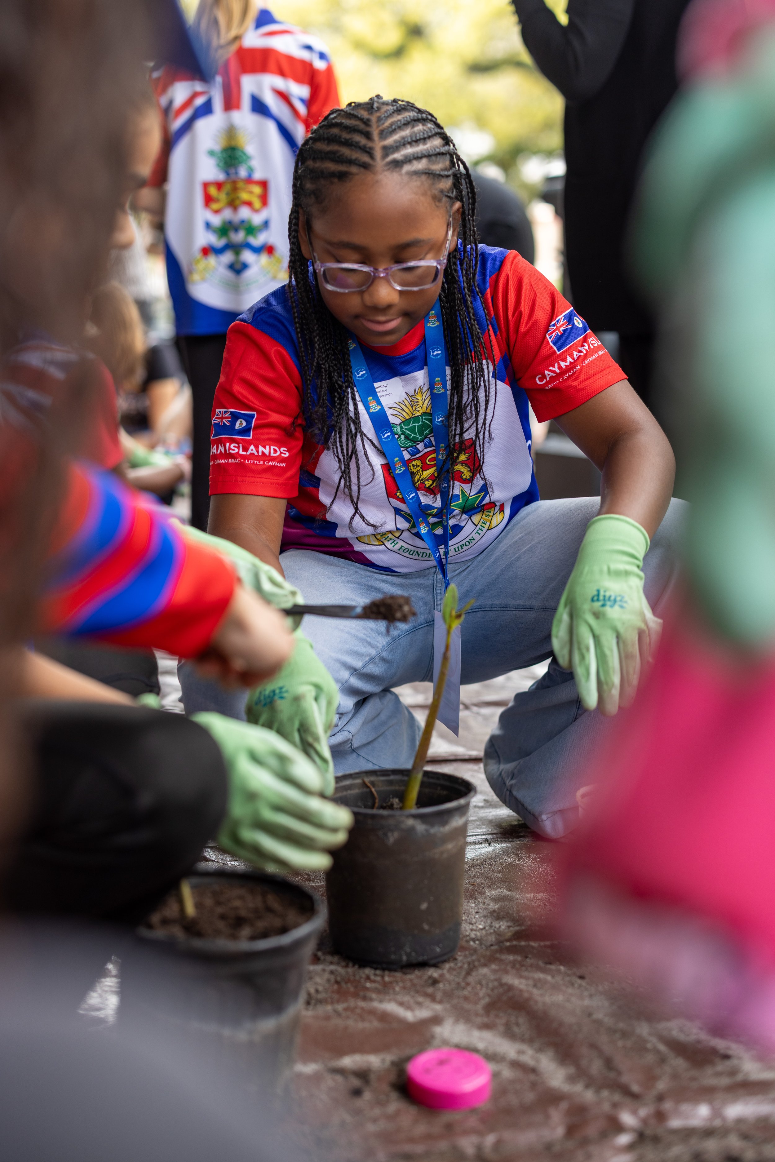 student planting mangrove tree