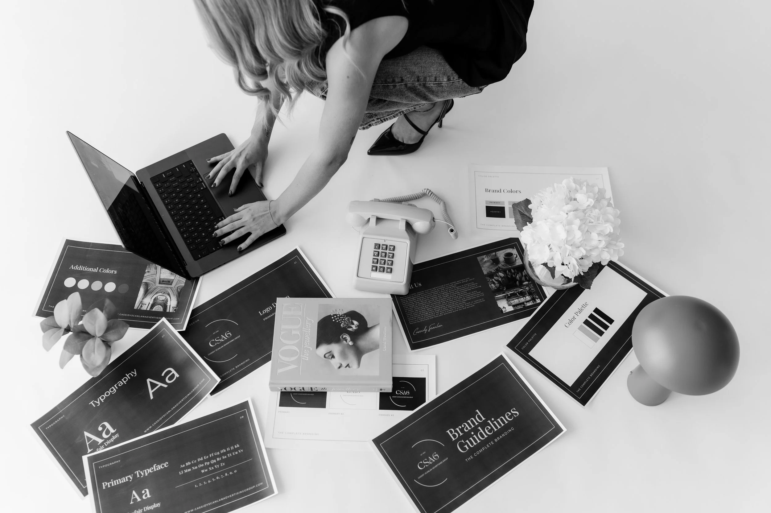 Collection of promotional flyers and sheets in Spanish, promoting real estate development and investment in San Luis, with titles in bold, blue, black, and orange backgrounds, featuring images of buildings and architectural designs.