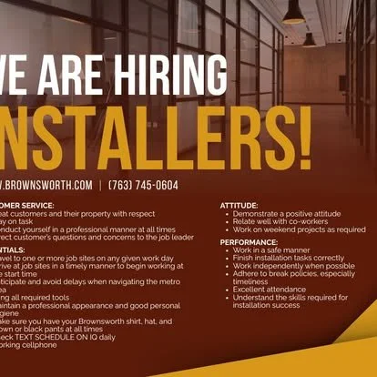 A job recruitment poster for installers with text listing contact information and job qualities, in a modern office setting.