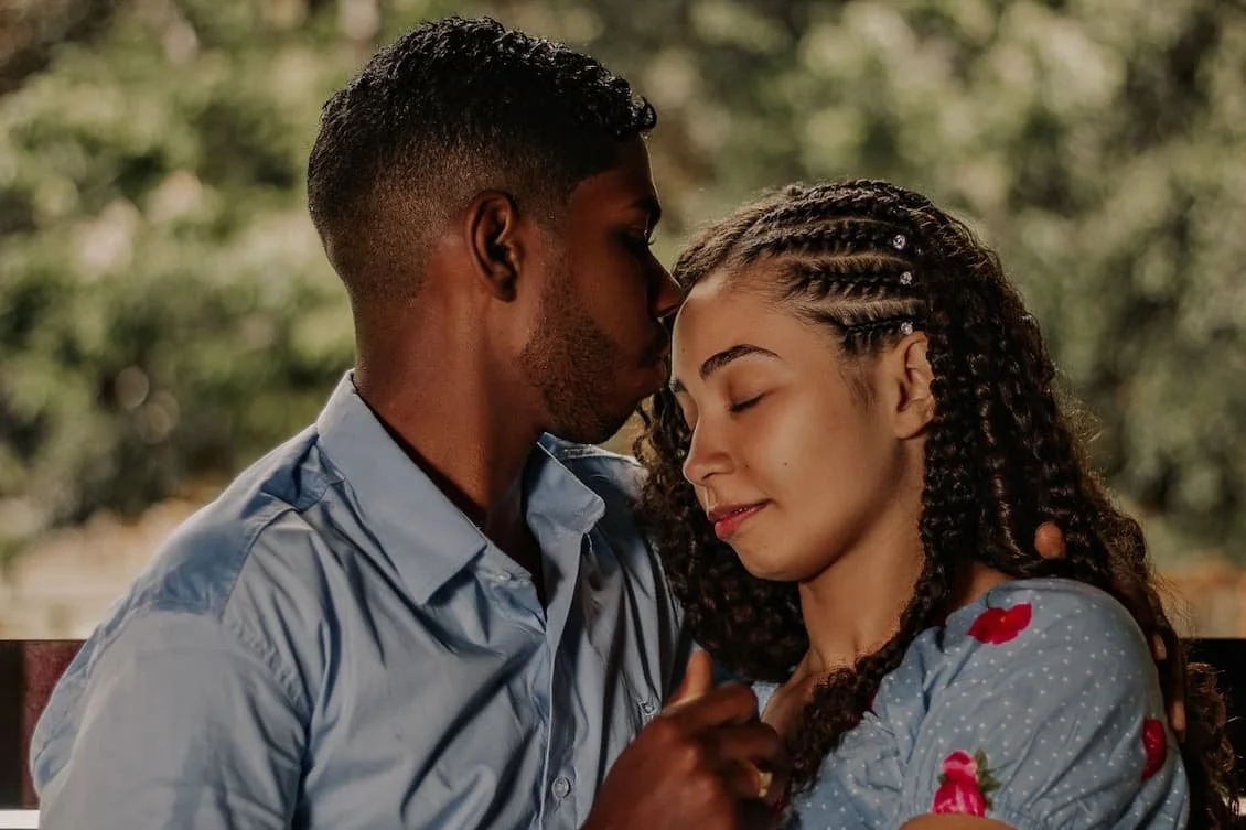 close-up-photo-of-man-kissing-his-partner-s-forehead