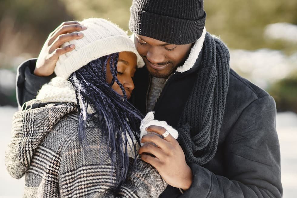 couple-in-winter-clothing-standing-close-together