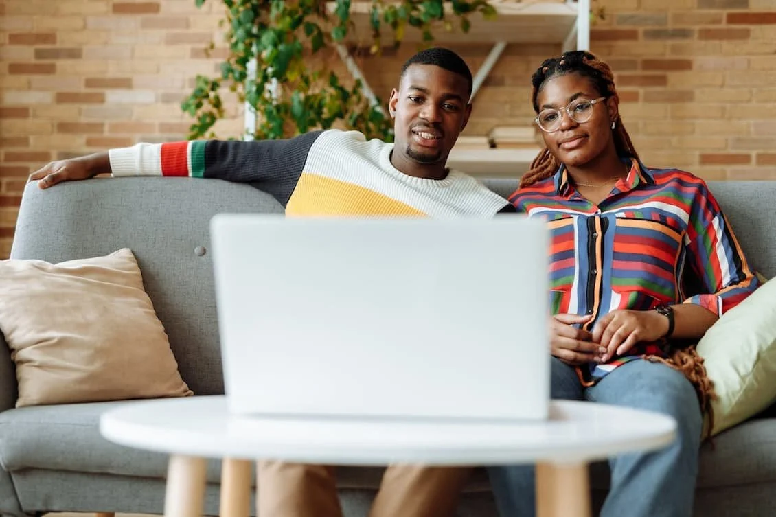 photo-of-a-man-and-a-woman-watching-on-a-laptop-together