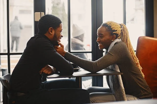couple-sitting-near-the-window