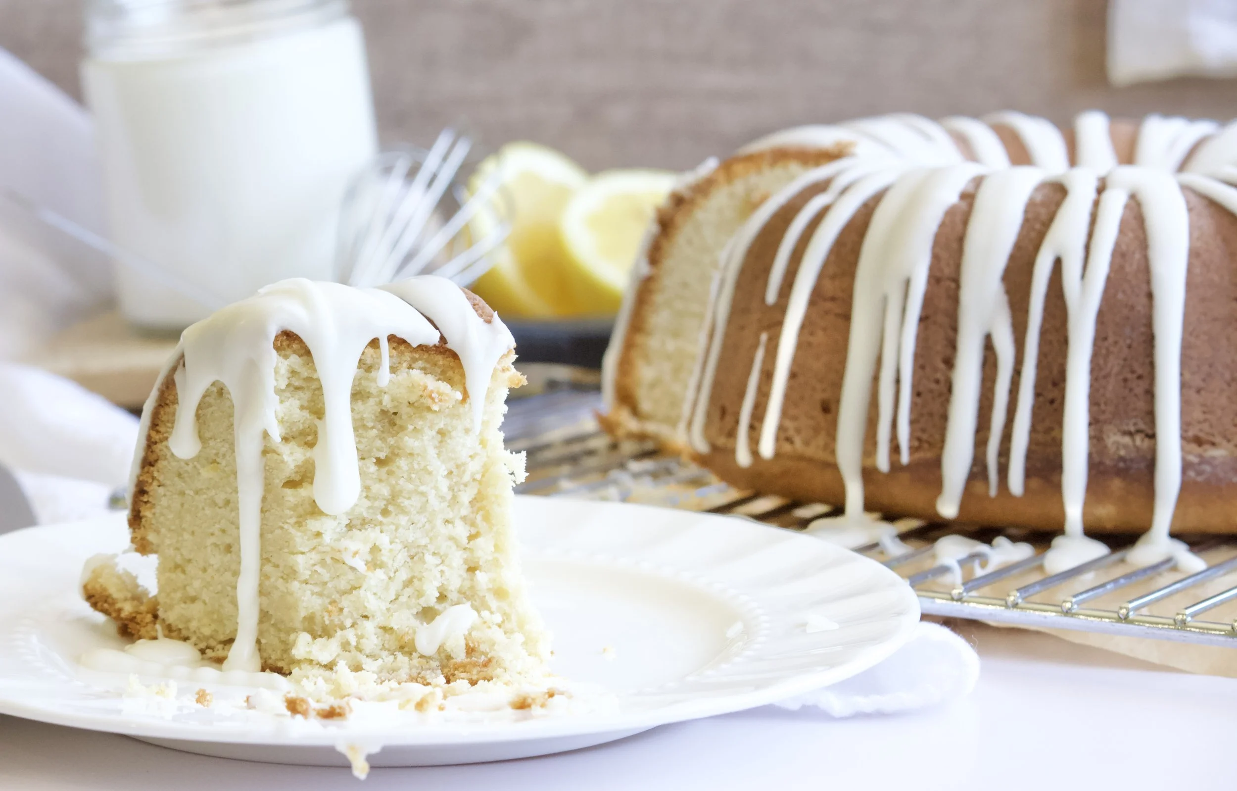 lemon pound bundt cake with a slice and lemon glaze