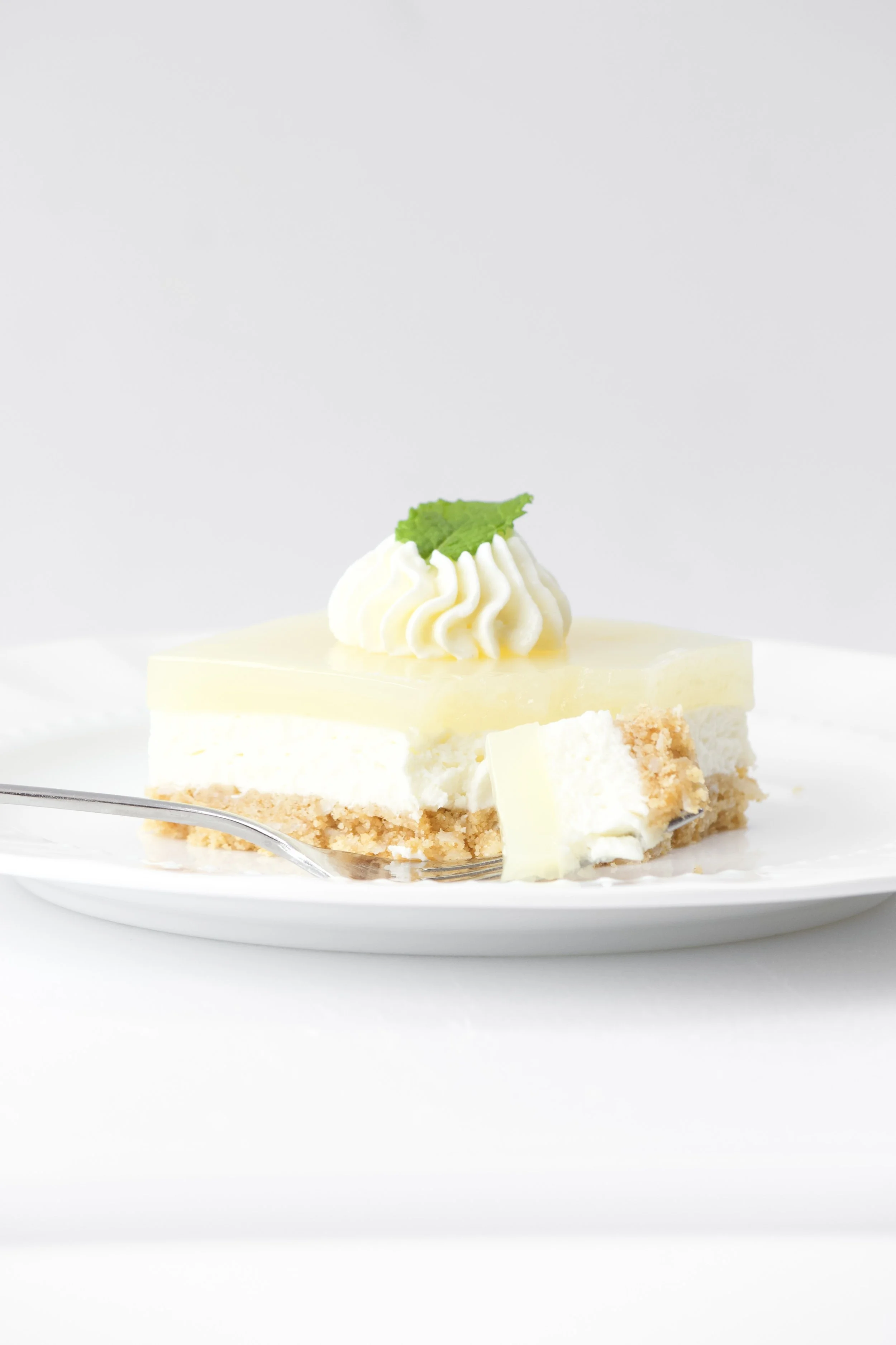 gluten-free key lime pie slice with mint garnish