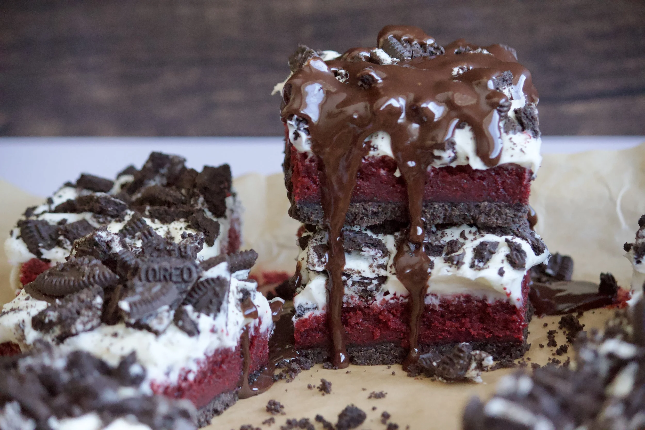 red velvet oreo brownies with white chocolate cream cheese frosting and chocolate ganache
