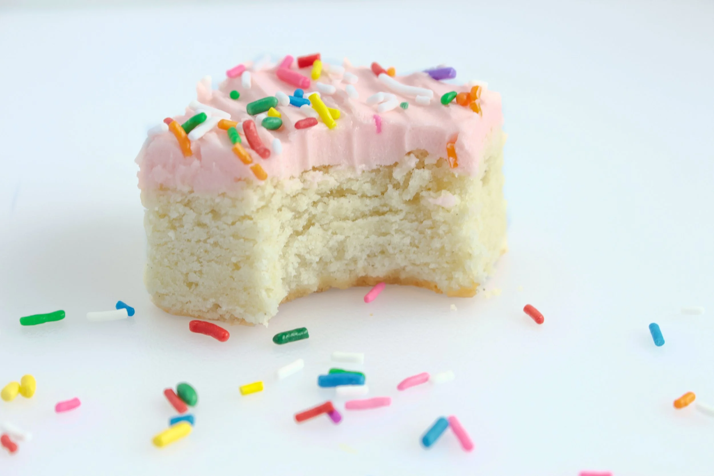 Gluten-Free Sugar Cookie Bar with Pink Buttercream and Rainbow Sprinkles