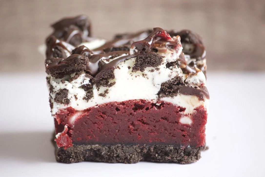 red velvet brownie with oreo crust and white chocolate cream cheese frosting and ganache