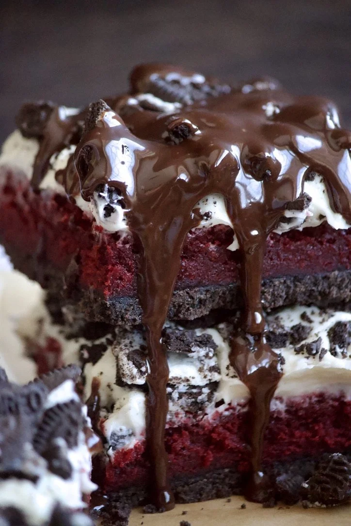 red velvet brownies with oreos and frosting and ganache
