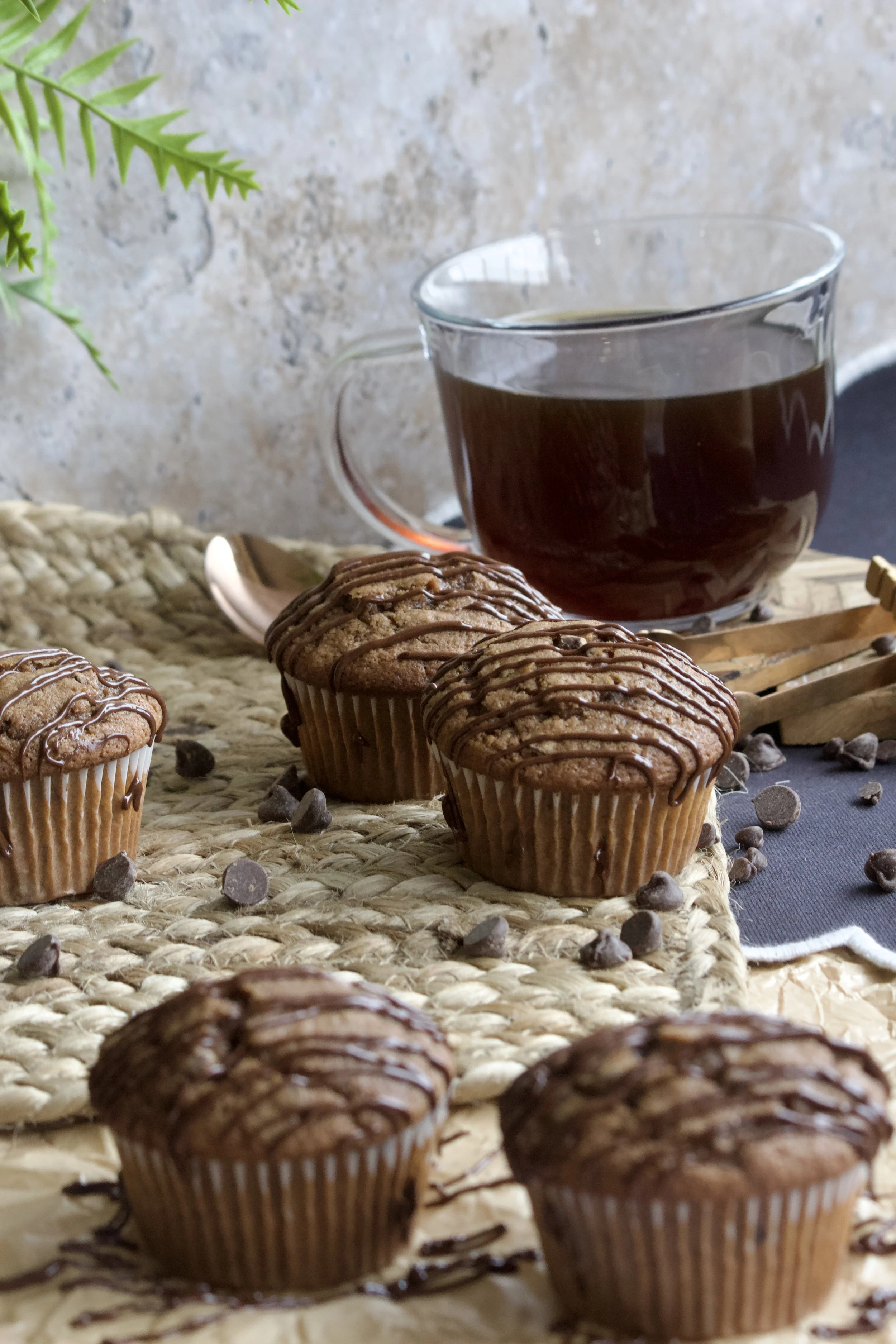 chocolate cappuccino muffins with melted chocolate and hot cup of coffee