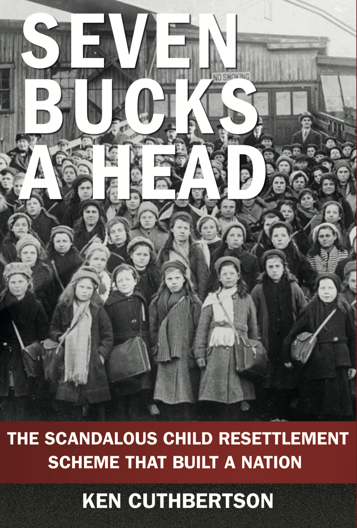 Black and white photo of a large group of children standing outdoors, with many appearing serious. Large text overlay reads 'Seven Bucks Ahead' and smaller text at the bottom says 'The scandalous child resettlement scheme that built a nation' by Ken Cuthbertson.