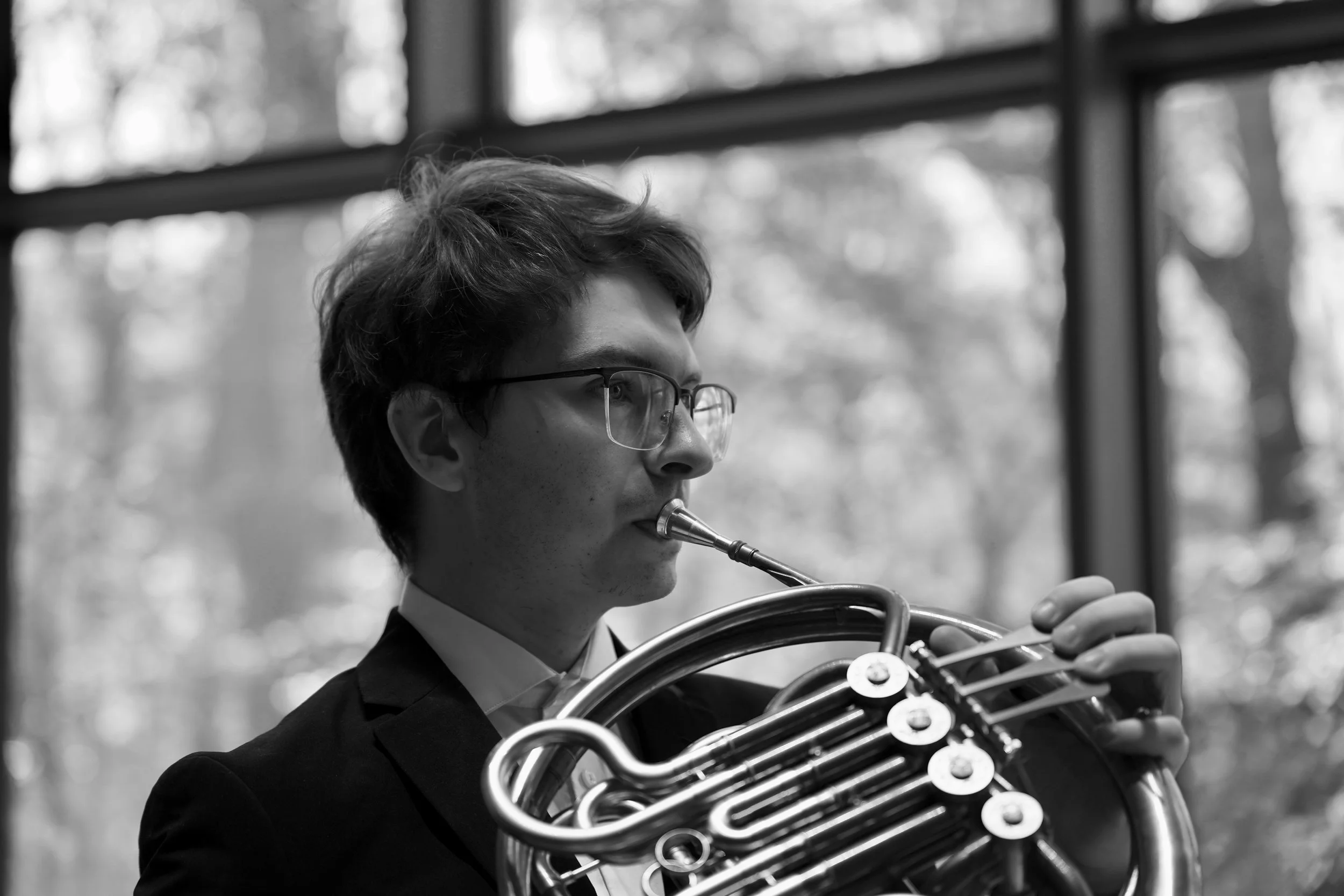 high school student playing french horn