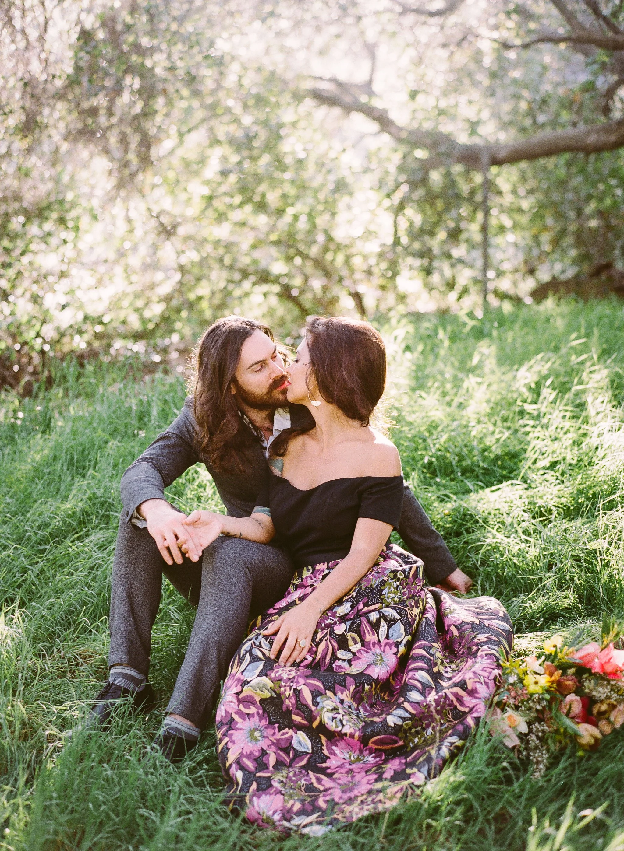 Couple sitting in grass
