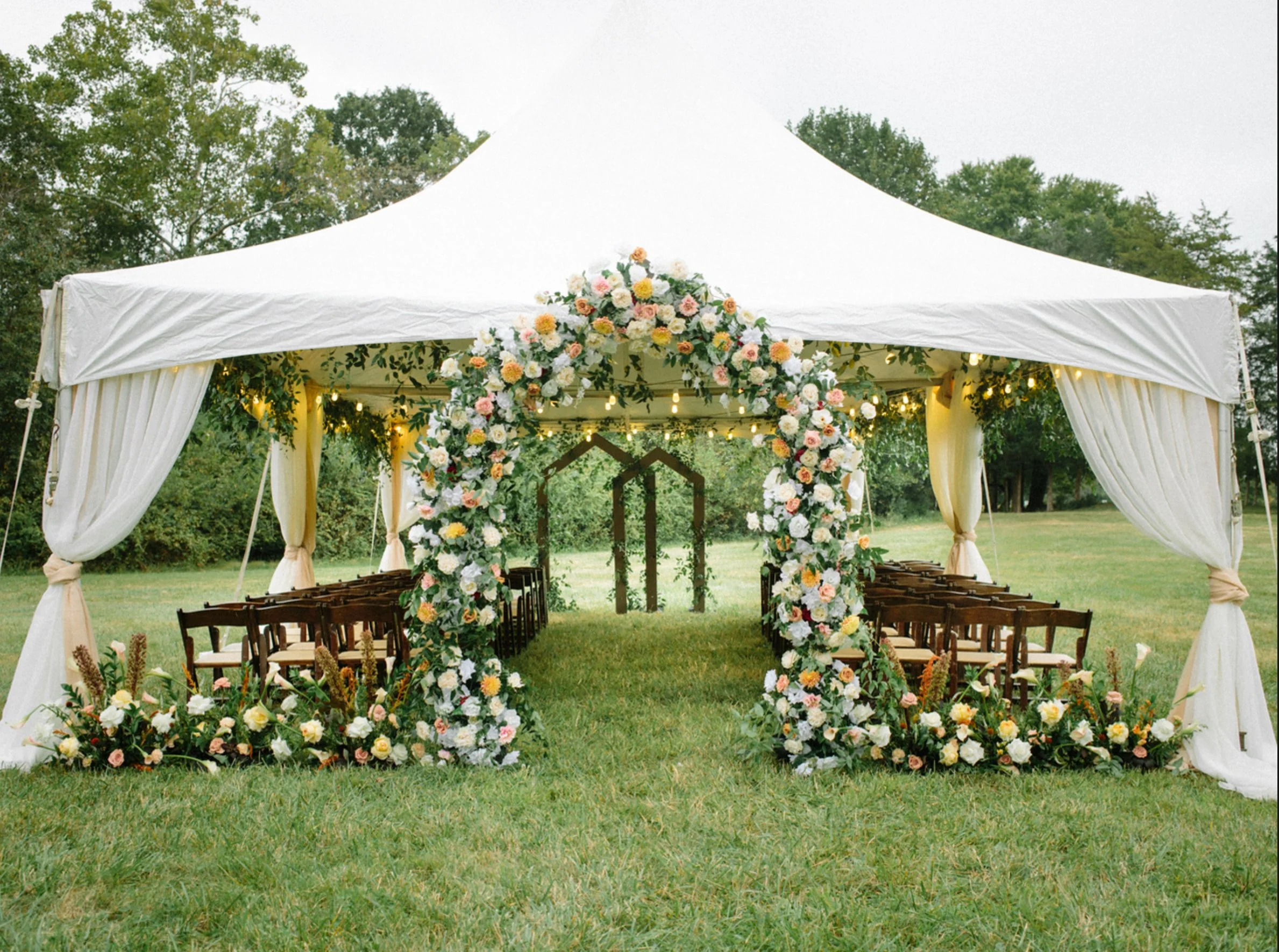 Luxury wedding flowers in tent